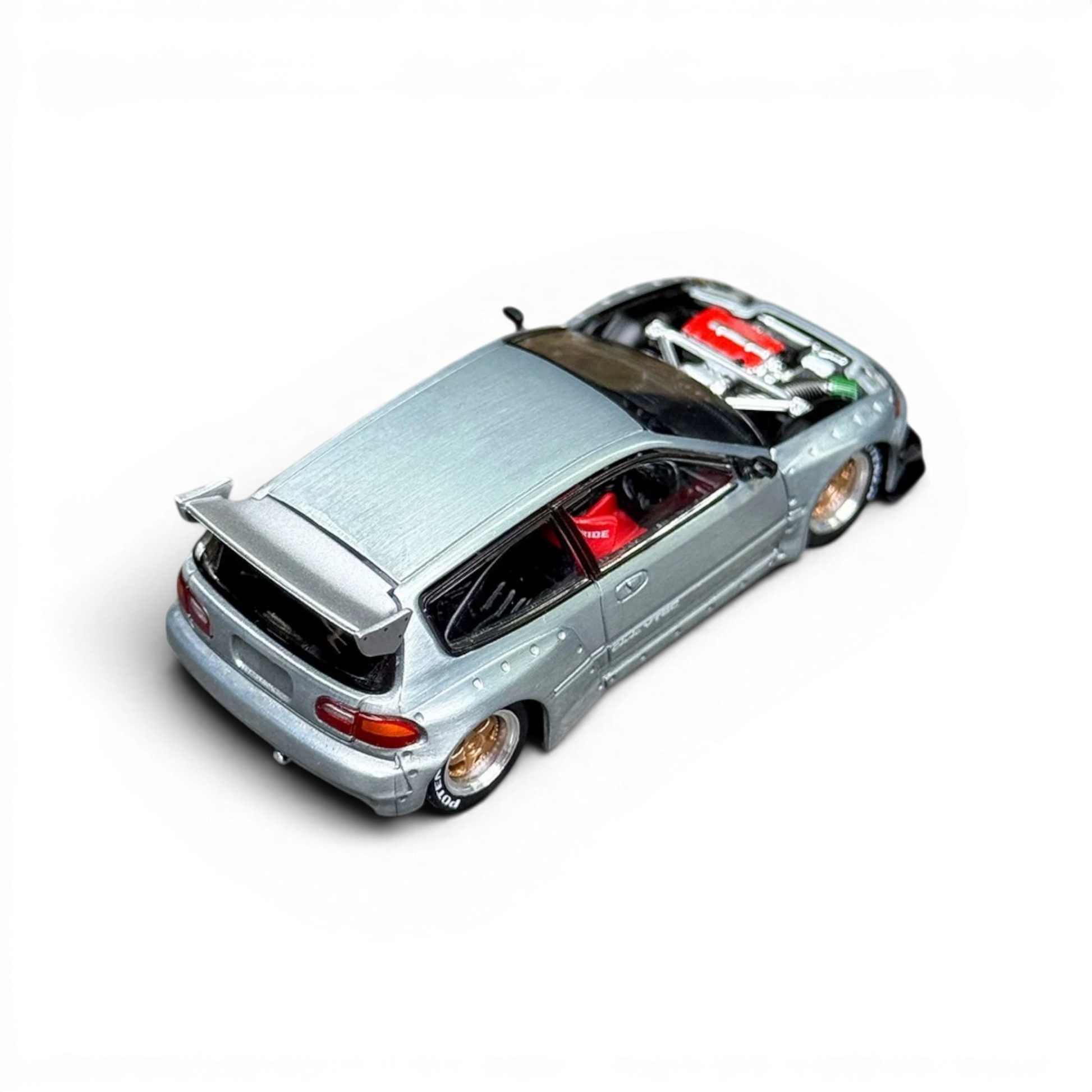 Lot57Supplies Diecast Shop 1:64 silver raw metal Honda Civic EG6 model car with red racing seats and detailed engine.