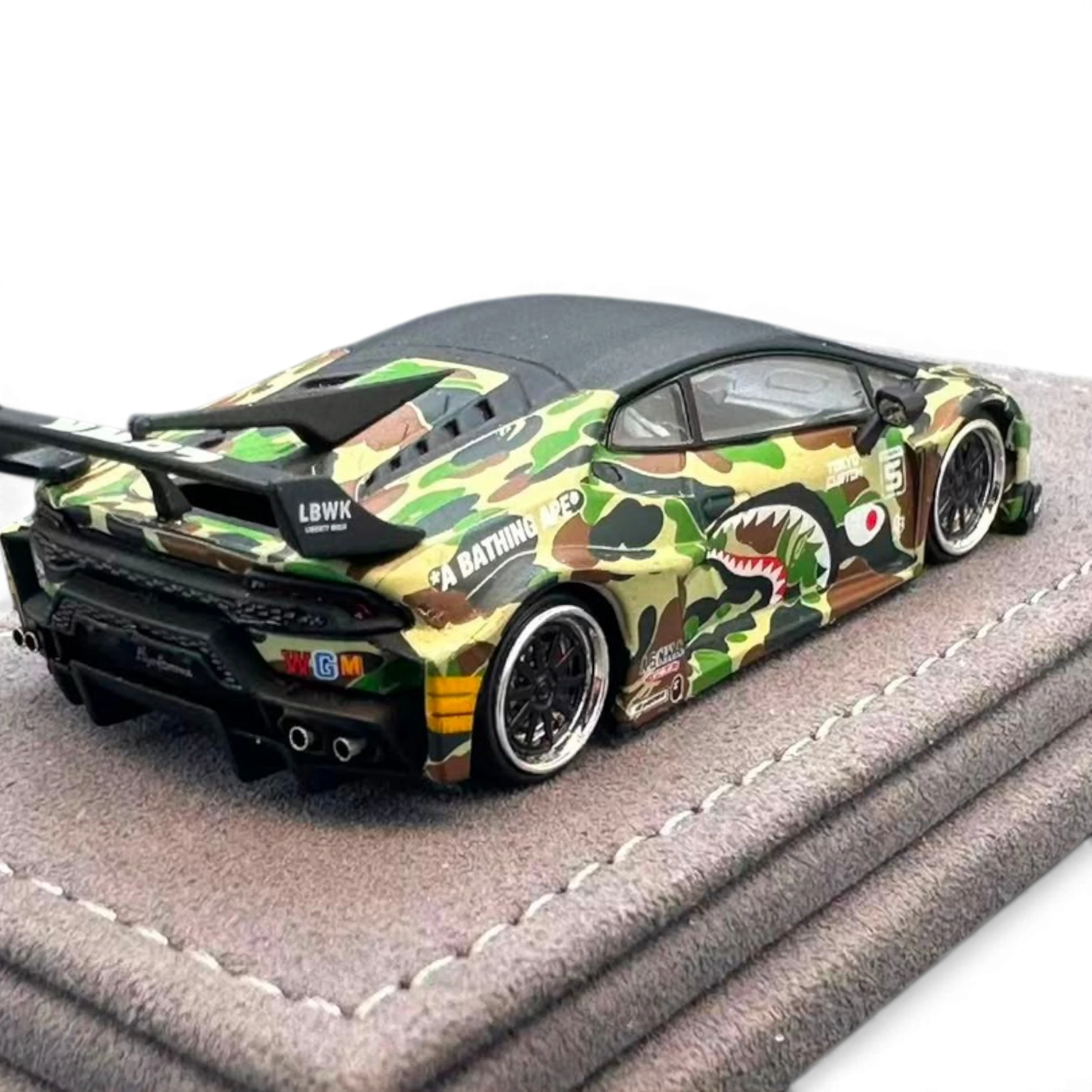Lot57Supplies Diecast Shop 1:64 scale DAP Huracan LB-Silhouette Works diecast car with Bape camo livery on plush base
