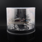 Lot57Supplies Diecast Shop Fine Works64 black and gold Impala lowrider diecast car on an electric turntable display