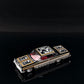 Lot57Supplies Diecast Shop 1:64 scale Fine Works64 Impala lowrider diecast car in black and gold with ornate detailing.