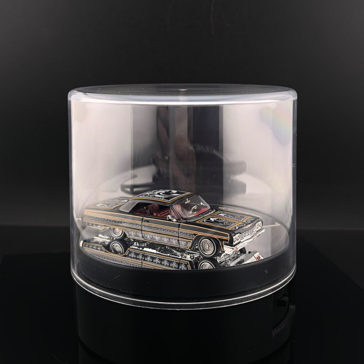 Lot57Supplies Diecast Shop Fine Works64 Impala lowrider diecast car in black and gold with electric display turntable