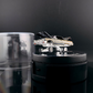 Lot57Supplies Diecast Shop Fine Works64 Impala lowrider diecast car in black and gold on an electric turntable