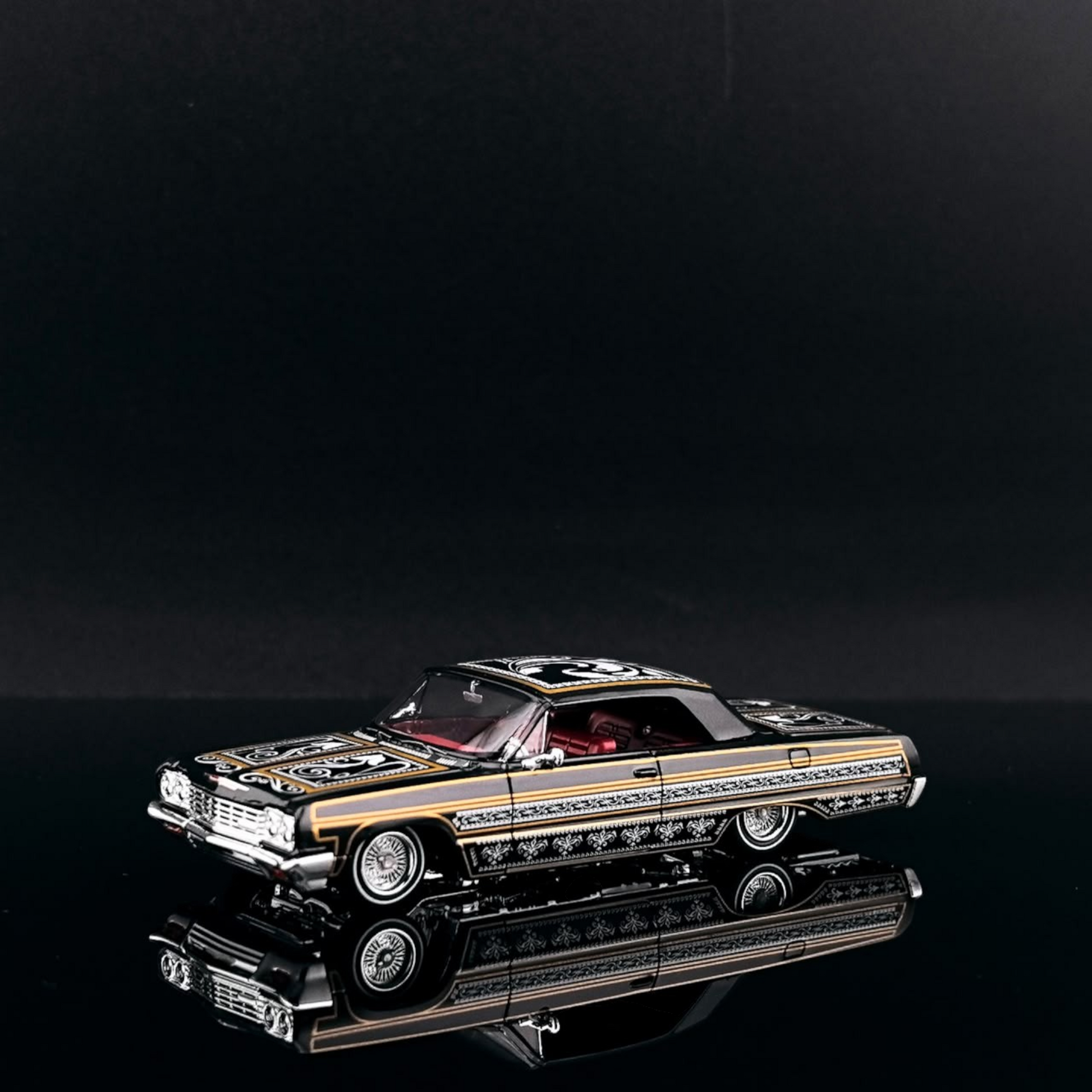 Lot57Supplies Diecast Shop 1:64 scale black and gold Impala lowrider diecast car with intricate detailing