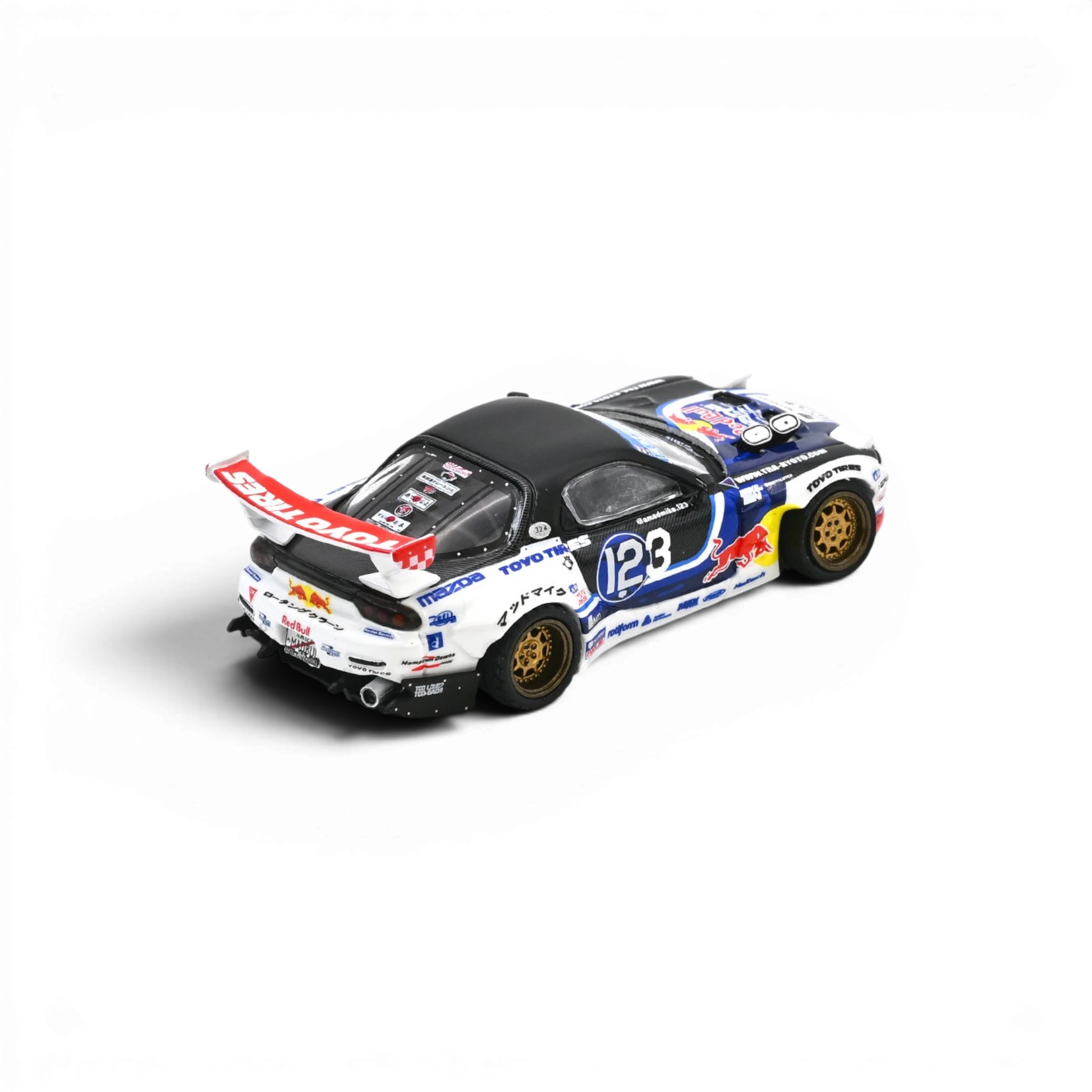 Lot57Supplies Diecast Shop Inno64 1:64 Mazda RX-7 Mad Mike MADBUL Gen8 drift car with detailed racing livery and wheels.