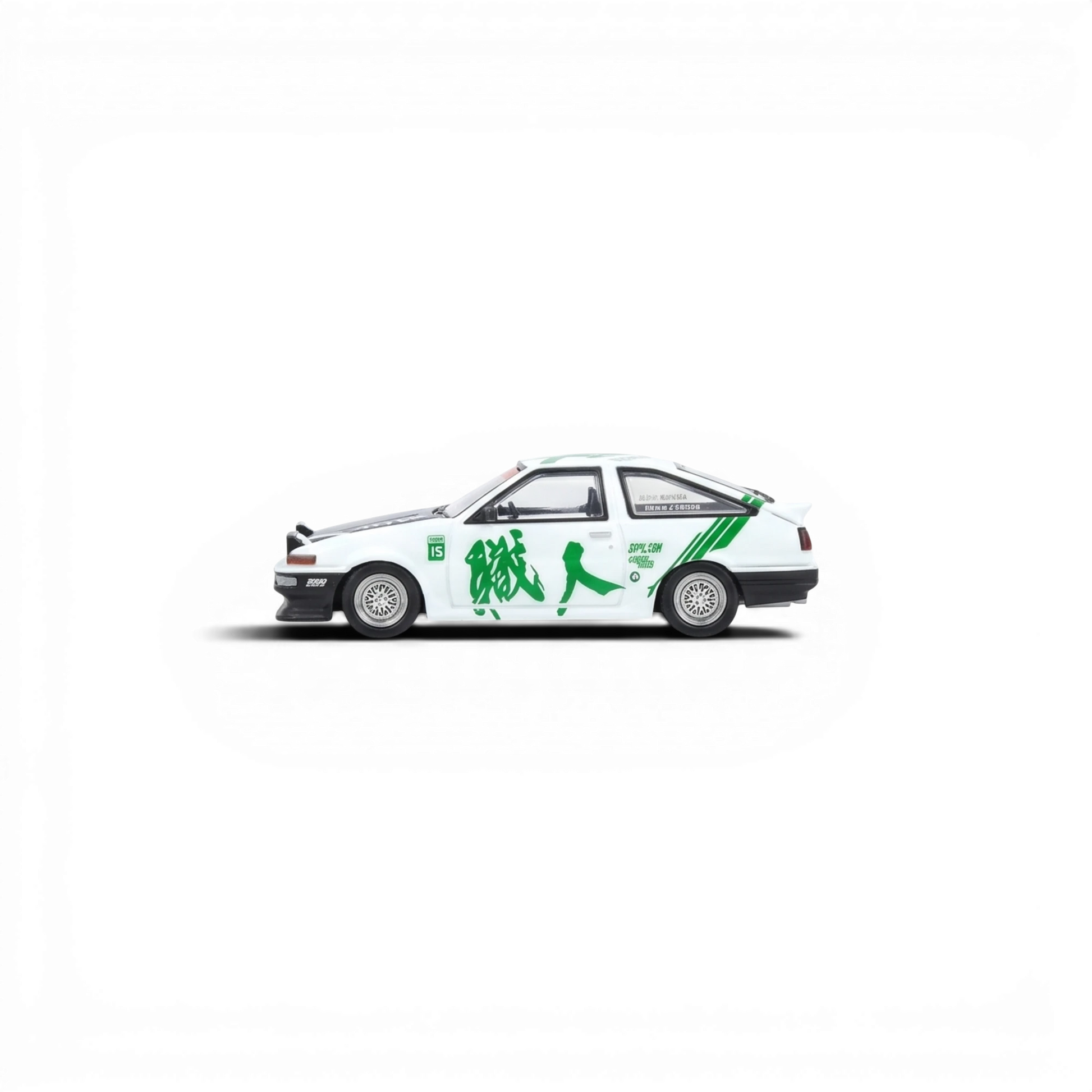 Lot57Supplies Diecast Shop white and green 1:64 scale Inno64 Toyota Sprinter Trueno AE86 diecast model car with Keiichi Tsuchiya tribute livery.
