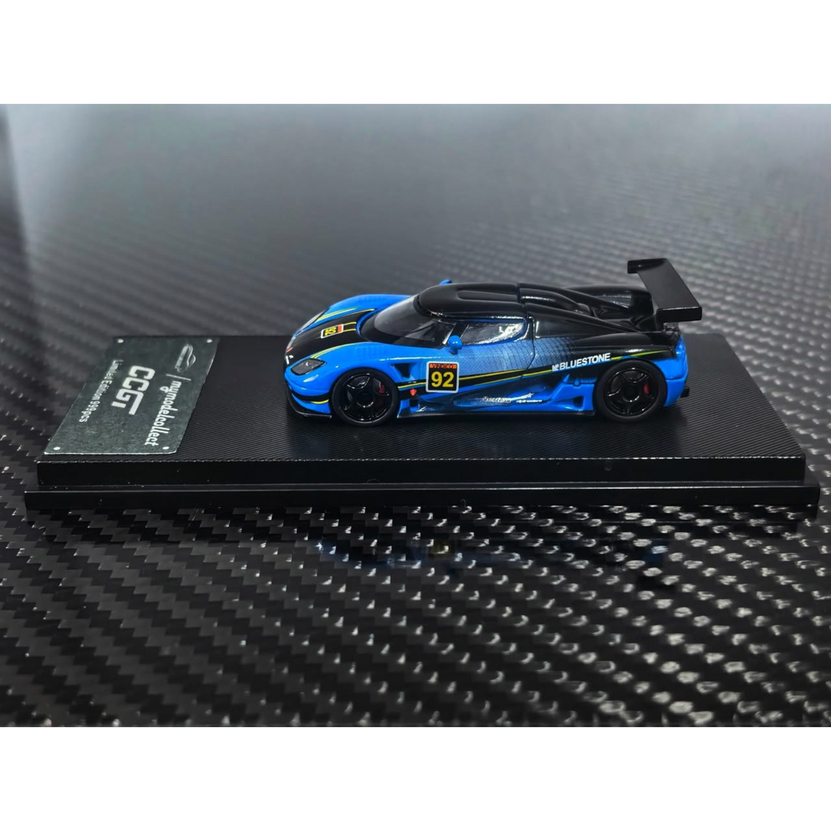 Lot57Supplies Diecast Shop 1:64 scale Koenigsegg CCGT diecast model car in blue and carbon fiber livery number 92