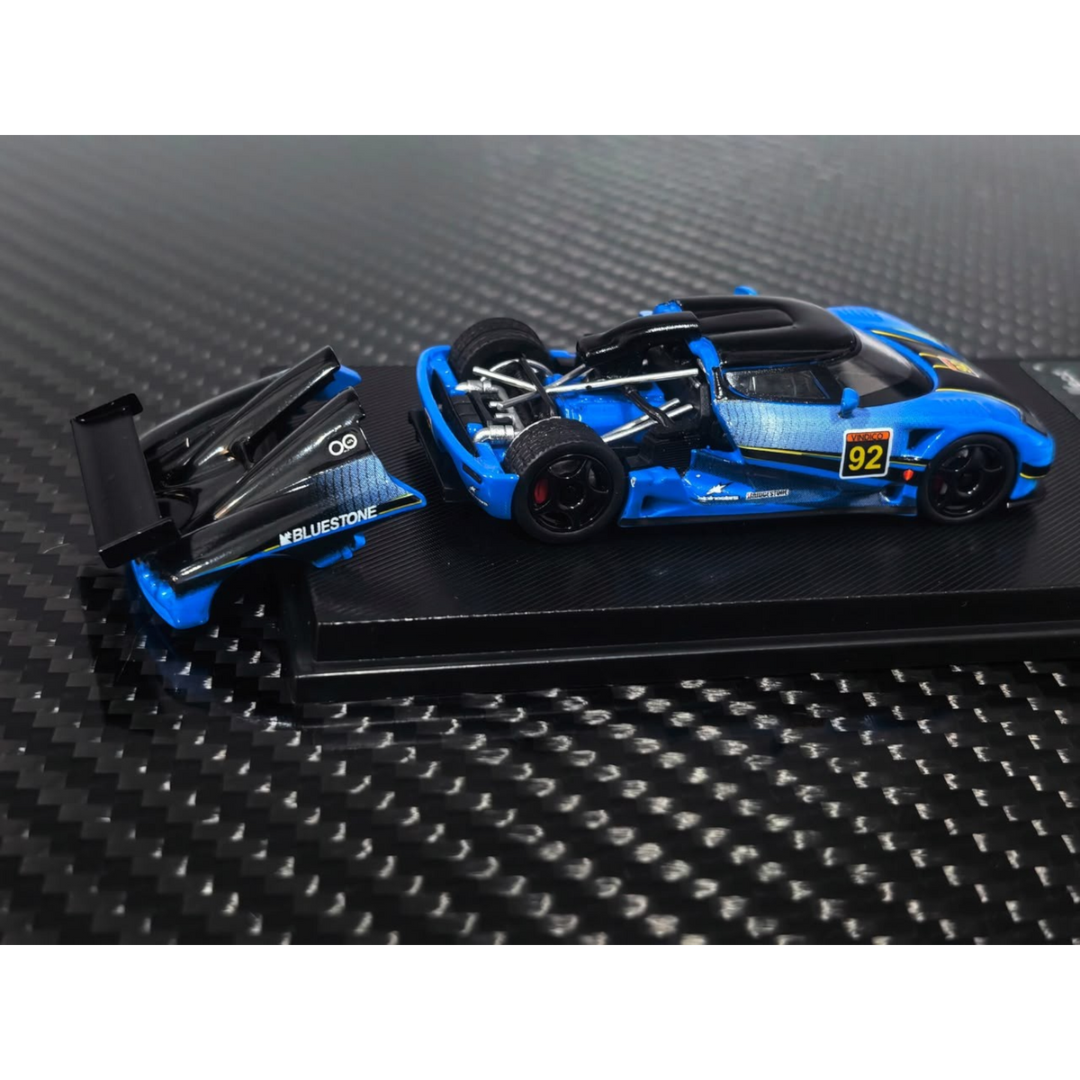 Lot57Supplies Diecast Shop 1:64 scale Koenigsegg CCGT diecast model in blue and carbon fiber livery with number 92