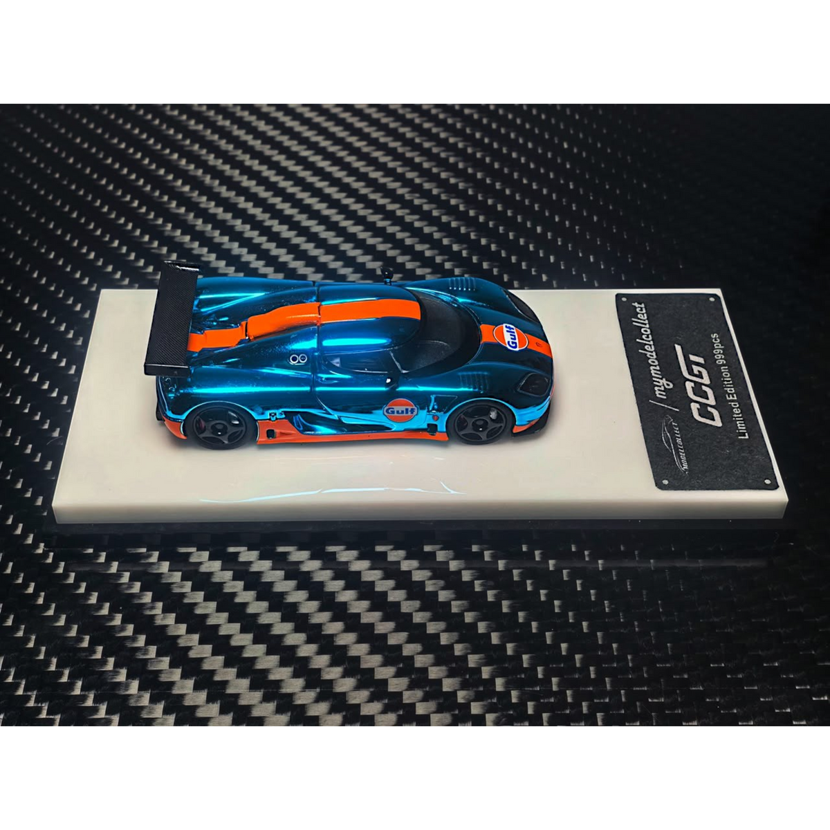 Lot57Supplies Diecast Shop 1:64 scale MC Koenigsegg CCGT diecast car in chrome Gulf blue and orange livery on display