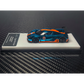Lot57Supplies Diecast Shop 1:64 scale diecast Koenigsegg CCGT in chrome Gulf blue and orange livery on display stand