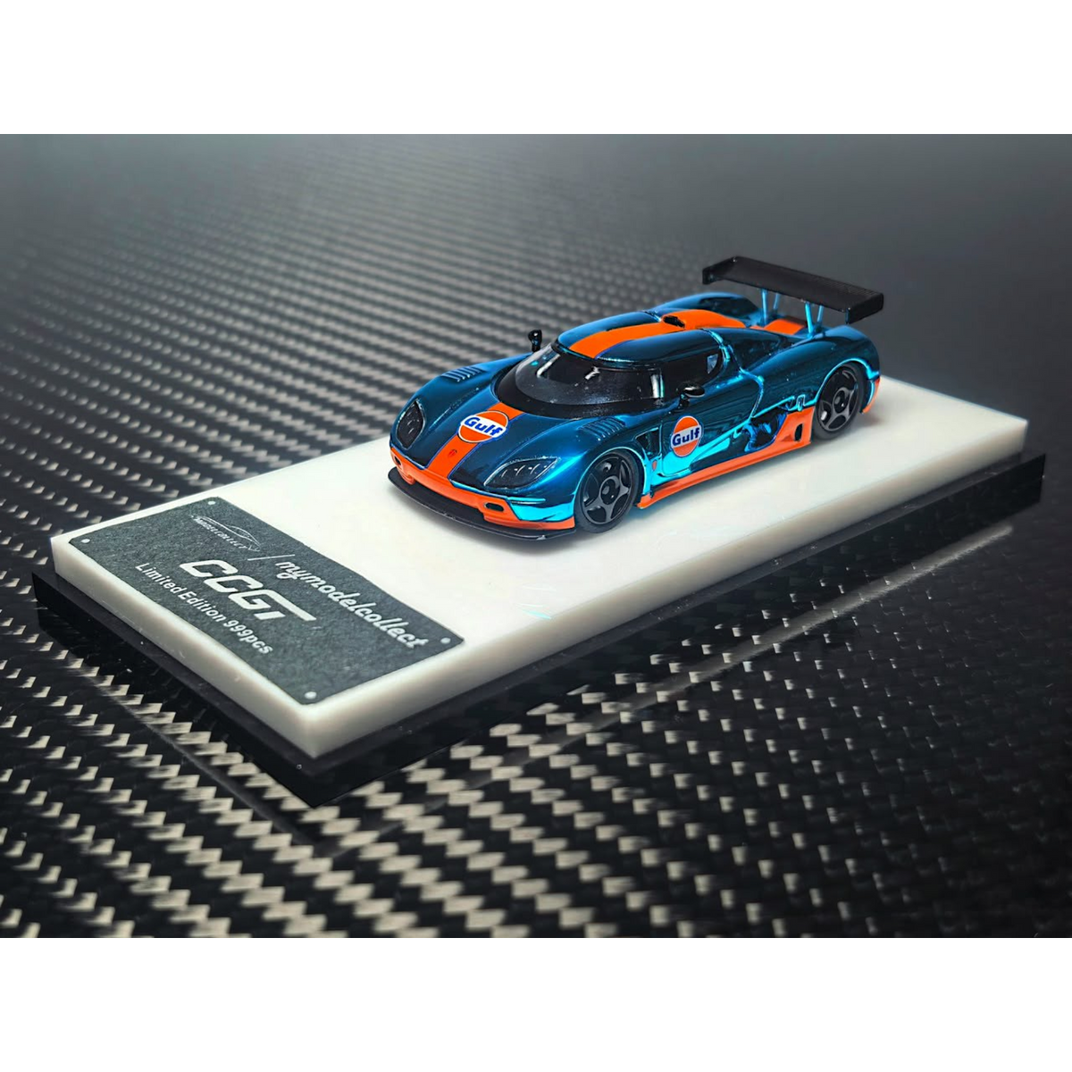 Lot57Supplies Diecast Shop 1:64 scale chrome Gulf blue and orange Koenigsegg CCGT diecast model car on display stand