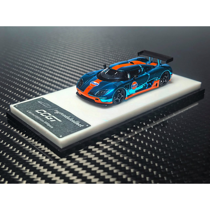 Lot57Supplies Diecast Shop 1:64 scale chrome Gulf blue and orange Koenigsegg CCGT diecast model car on display stand
