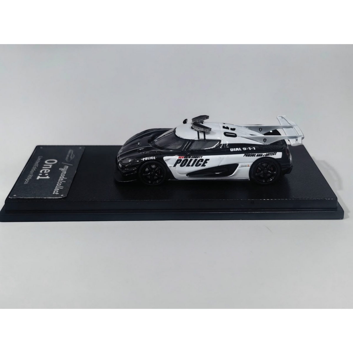 Lot57Supplies Diecast Shop 1:64 scale MC Koenigsegg One:1 diecast model car in black and white police livery