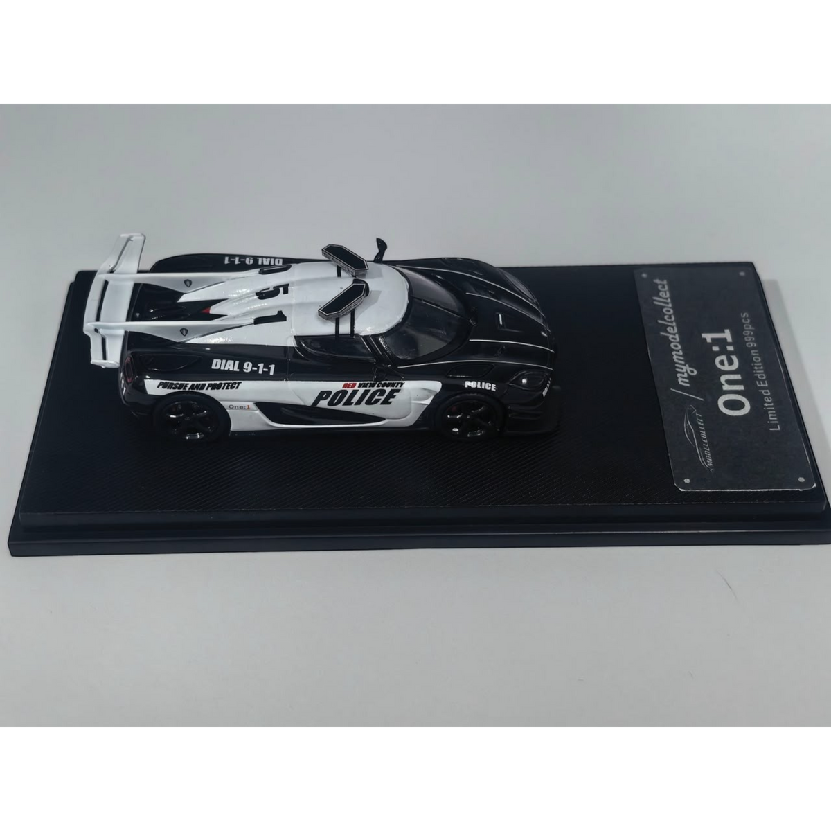 Lot57Supplies Diecast Shop 1:64 scale MC Koenigsegg One:1 diecast model car in black and white police livery