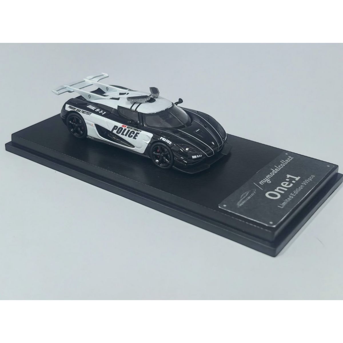 Lot57Supplies Diecast Shop 1:64 scale MC Koenigsegg One:1 diecast model car in black and white police livery