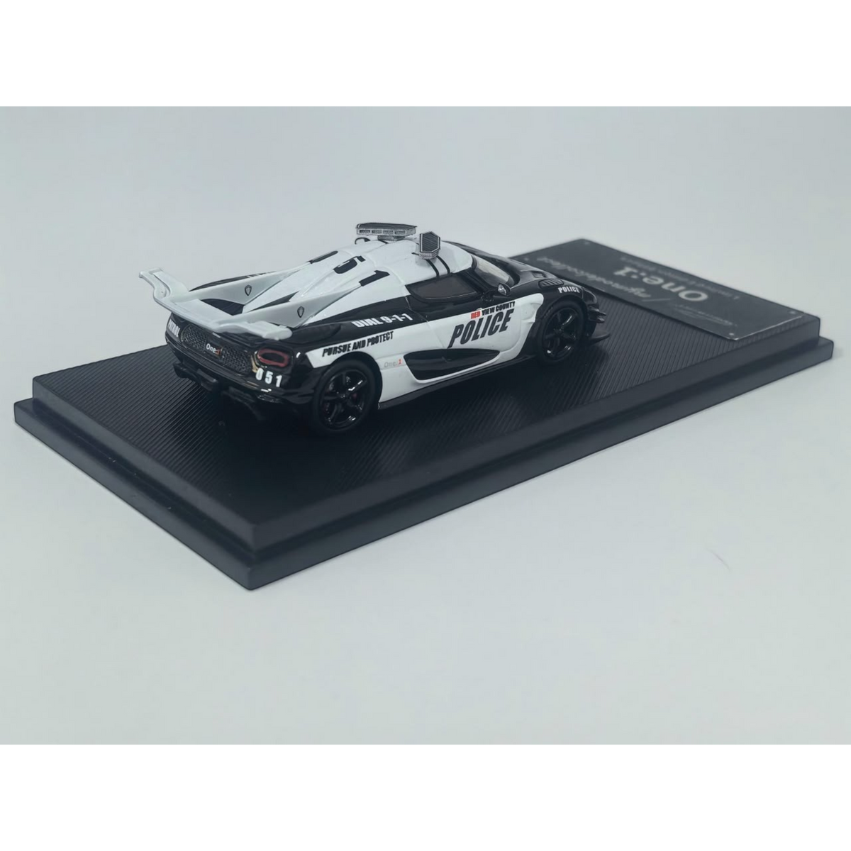 Lot57Supplies Diecast Shop 1:64 scale MC Koenigsegg One:1 diecast model car in black and white police livery