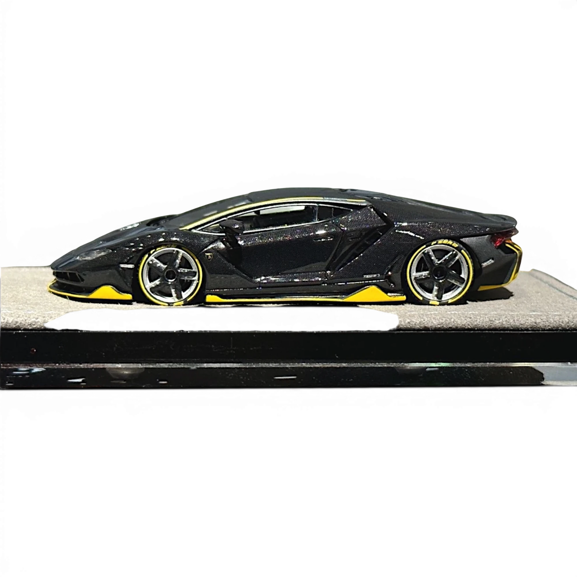 Lot57Supplies Diecast Shop HH Model 1:64 scale Lamborghini Centenario in black carbon with yellow accents side view