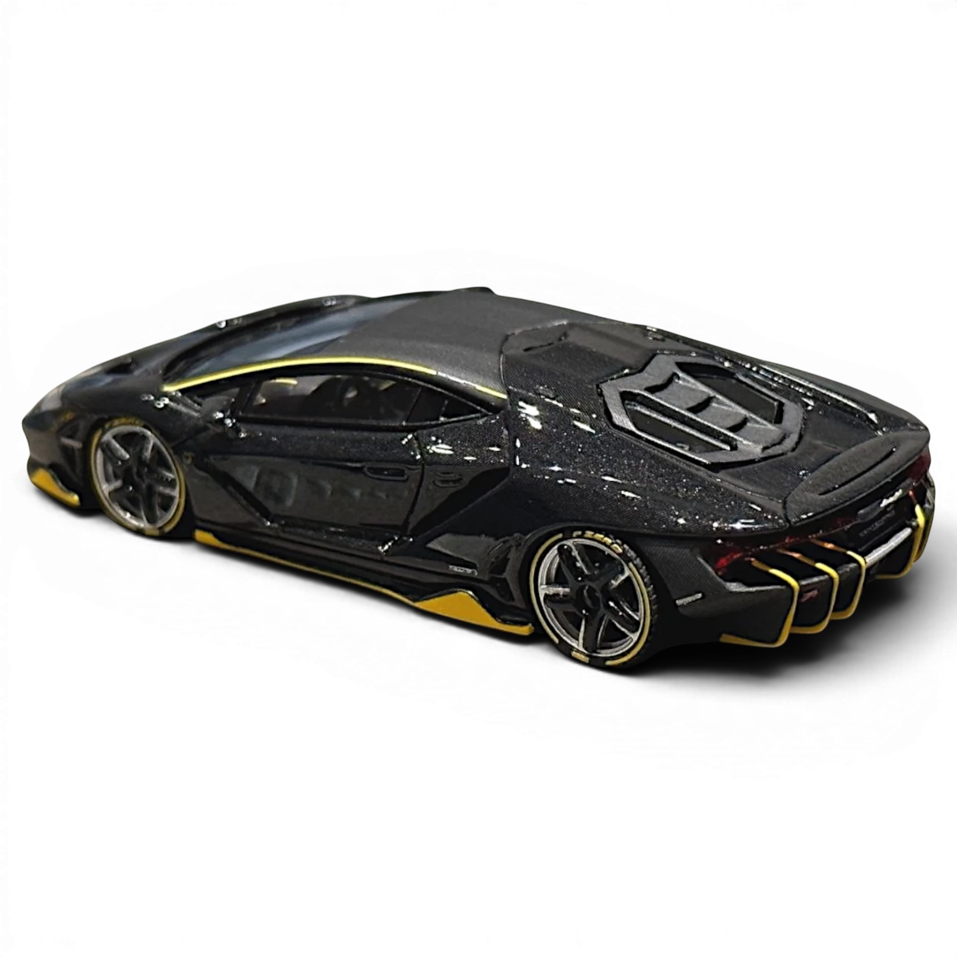 Lot57Supplies Diecast Shop 1:64 scale resin Lamborghini Centenario model car in black carbon with yellow accents.