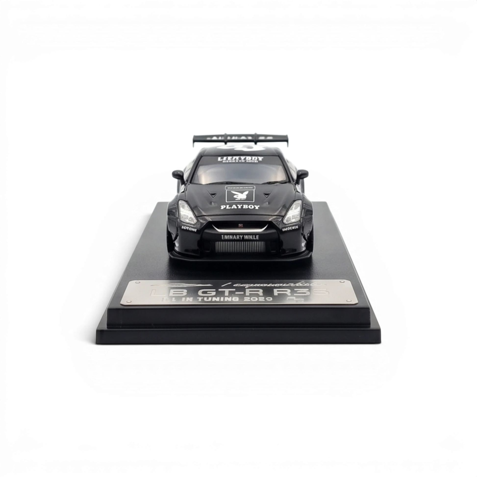 Lot57Supplies Diecast Shop 1:64 scale glossy black LB GTR 1.5 diecast model car with PLAYBOY livery on display base.