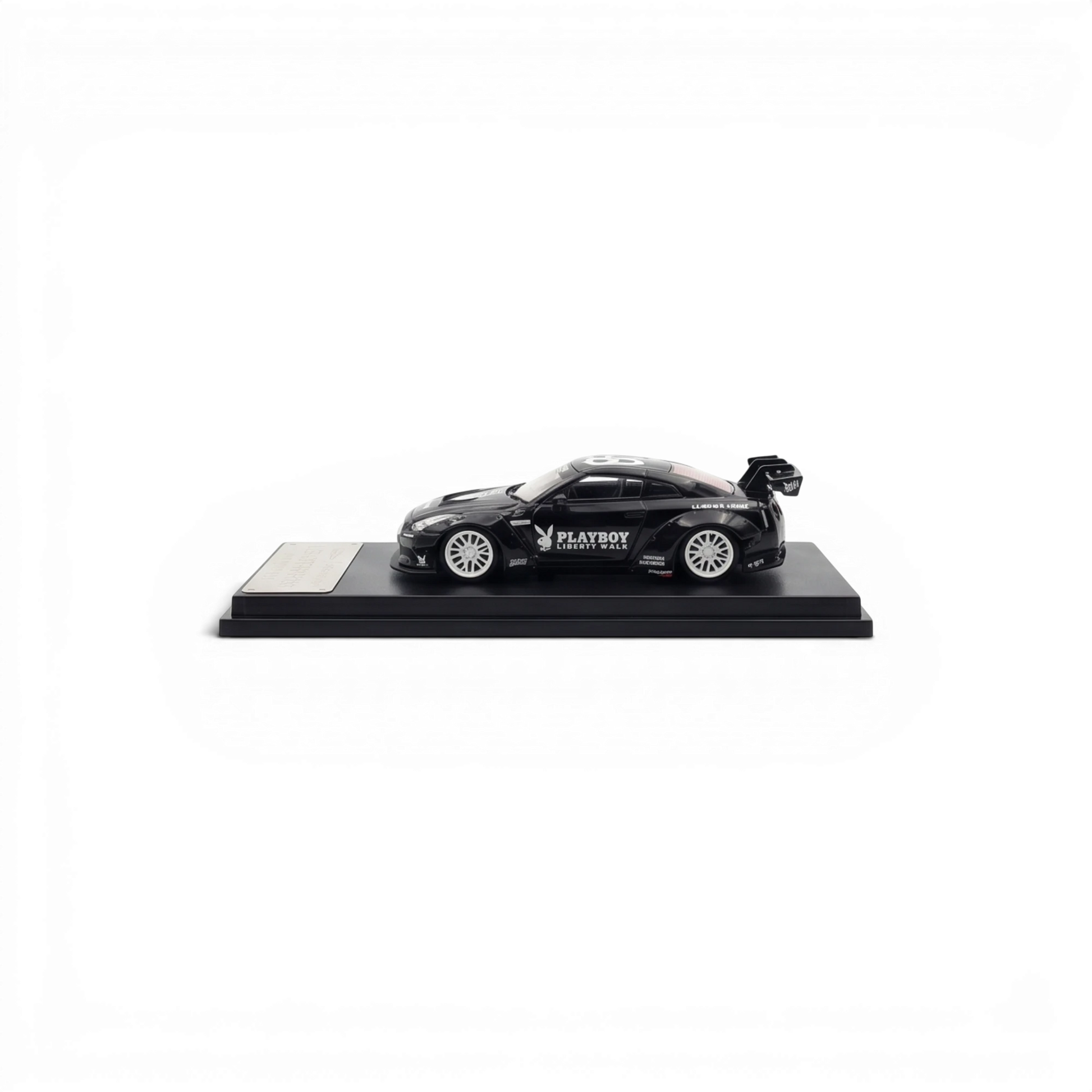 Lot57Supplies Diecast Shop 1:64 scale glossy black LB GTR 1.5 diecast model car with white PLAYBOY livery on display.
