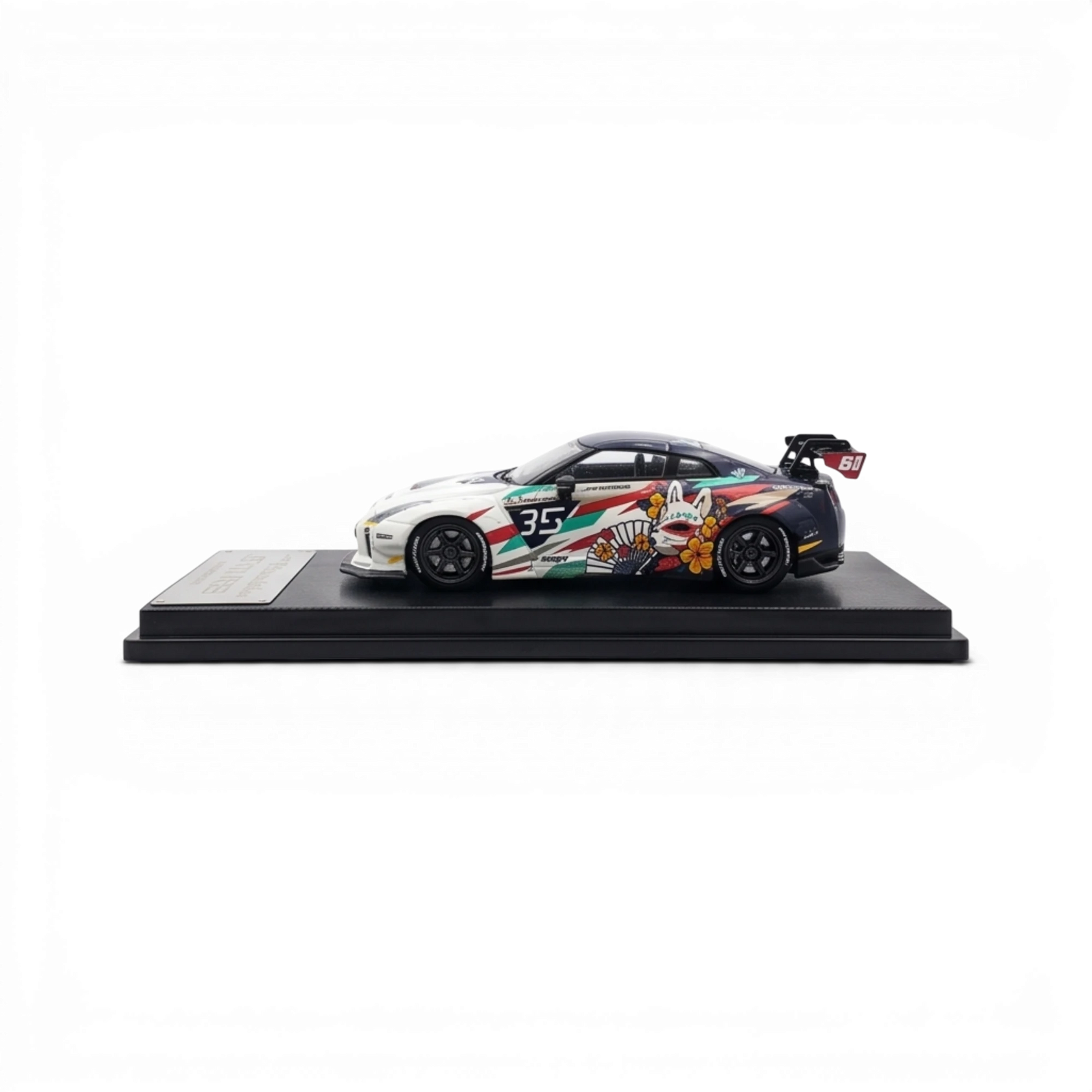 Lot57Supplies Diecast Shop 1:64 scale MC LB GTR 1.5 diecast model car with Kitsune mask anime livery on display base