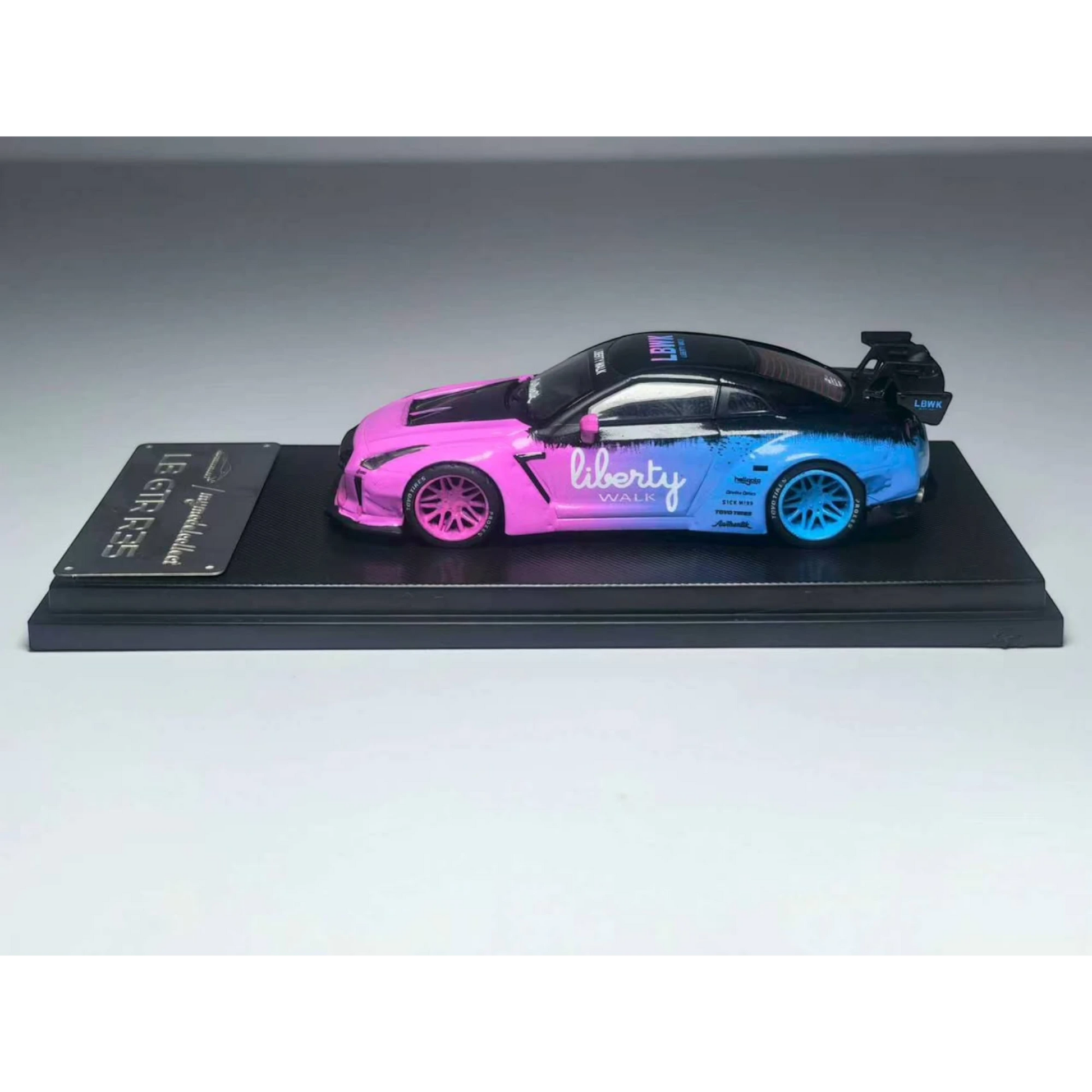 Lot57Supplies Diecast Shop 1:64 scale MC LB GTR 1.5 diecast car in a flash pink and blue gradient livery