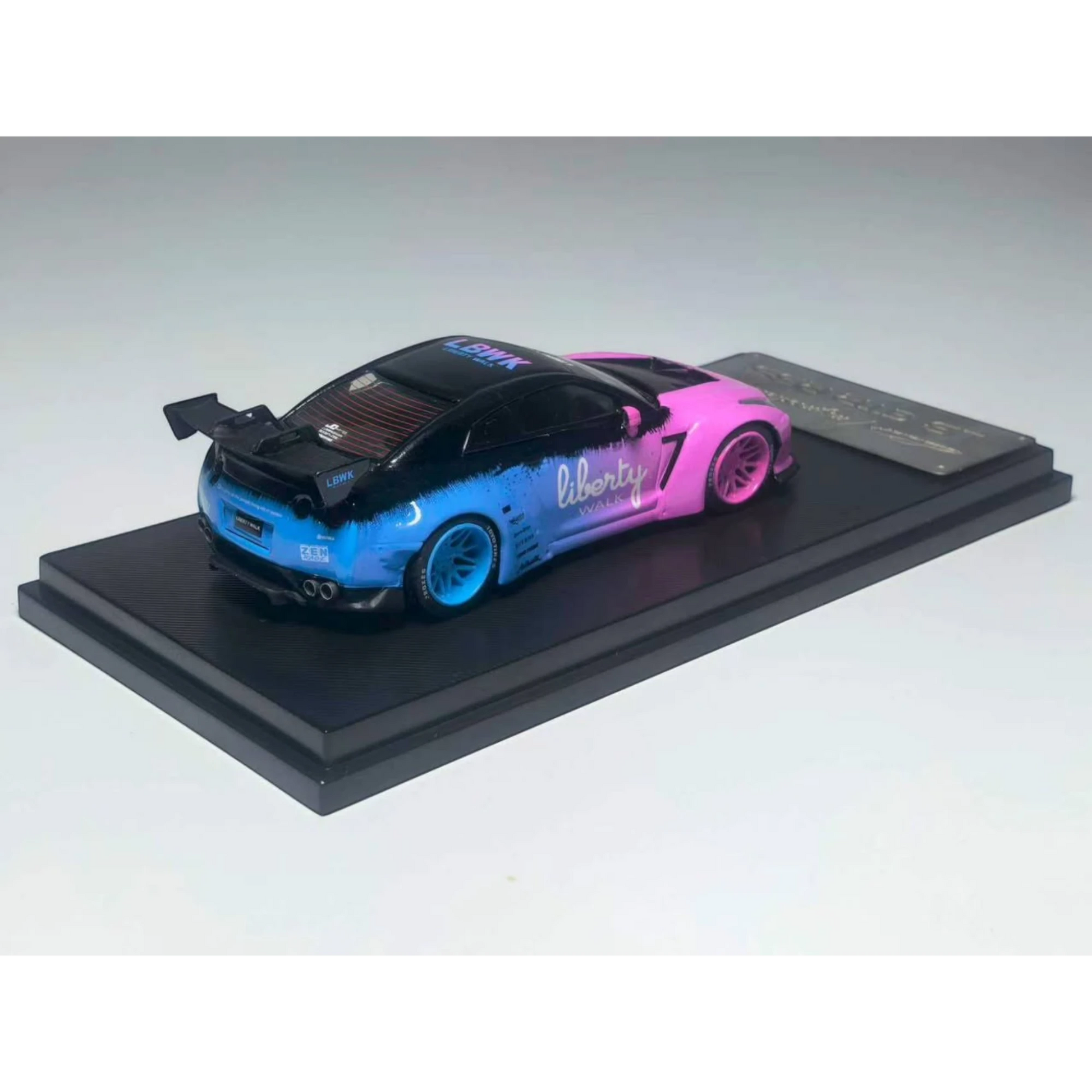 Lot57Supplies Diecast Shop 1:64 scale MC LB GTR 1.5 diecast model car in a pink and blue gradient livery