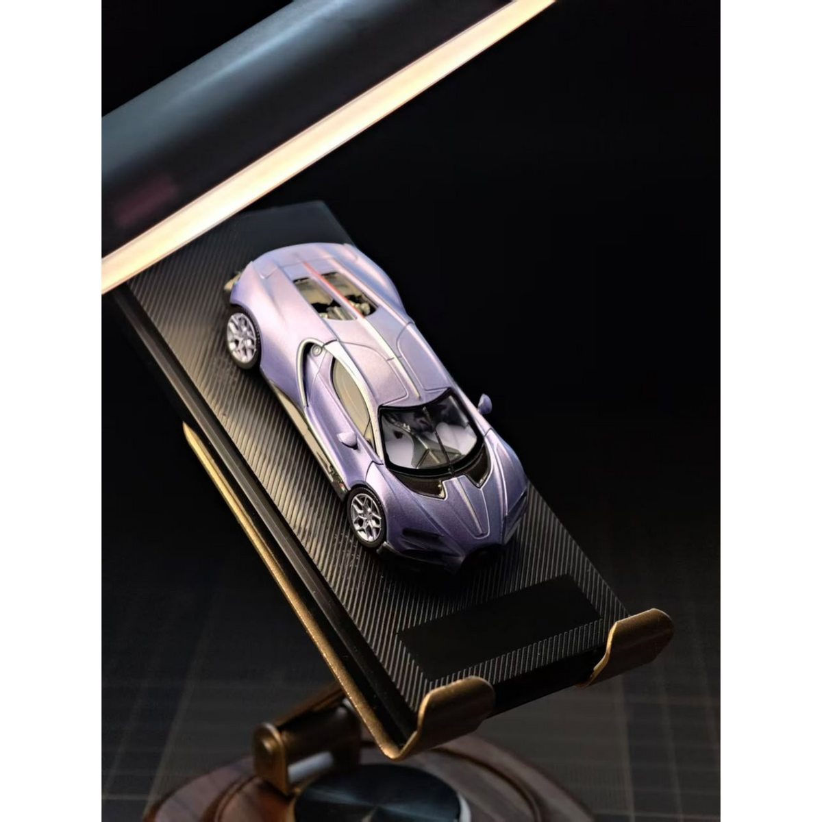 Lot57Supplies Diecast Shop Liberty 64 Tourbillon 1:64 scale diecast car in metallic electric purple on display stand