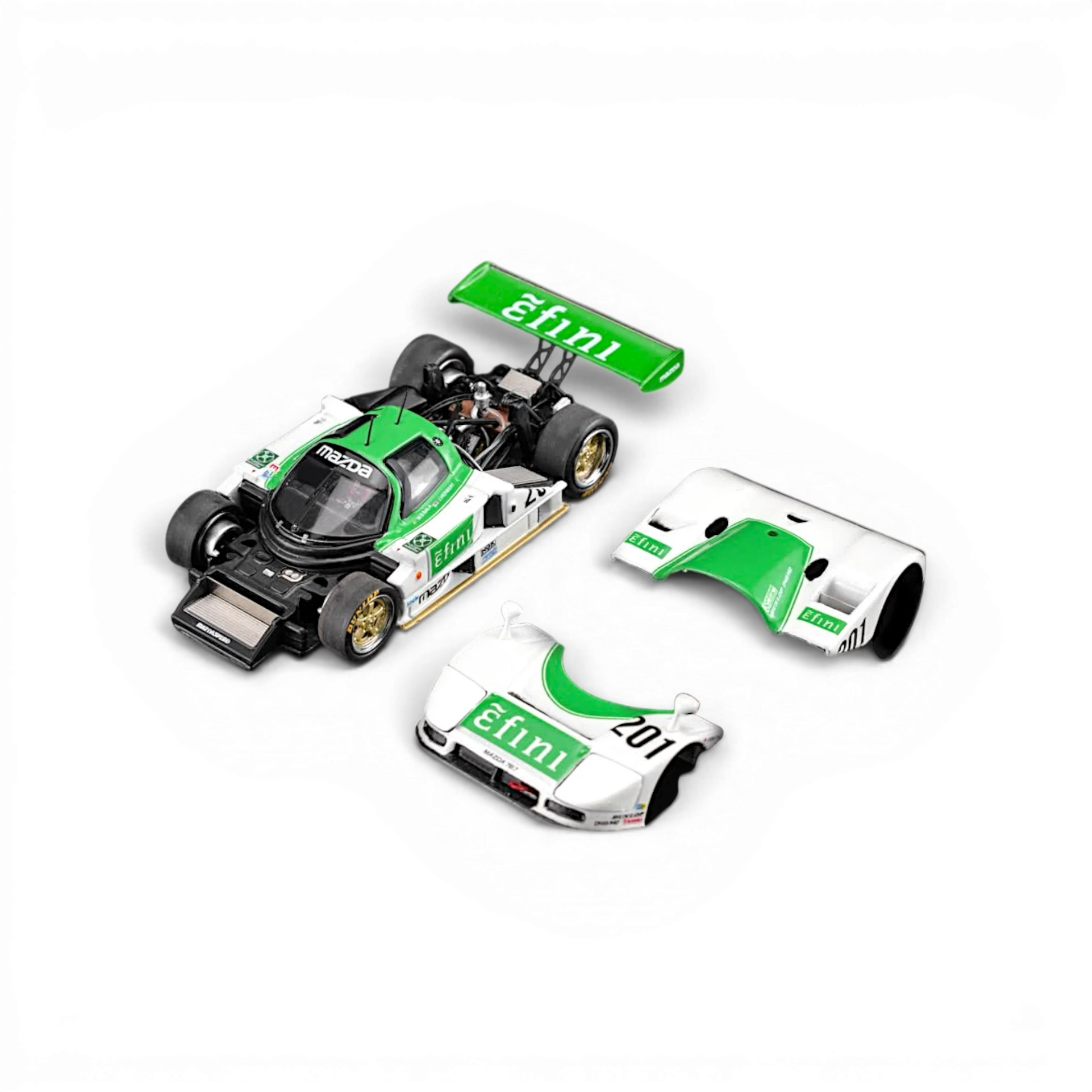 Lot57Supplies Diecast Shop MOTORHELIX Mazda 787B 1:64 scale diecast model in green and white with removable body parts