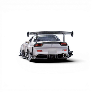 Lot57Supplies Diecast Shop Pearl White Mazda RX-7 FD 1:64 scale model with large carbon fiber wing and detailed exhaust.