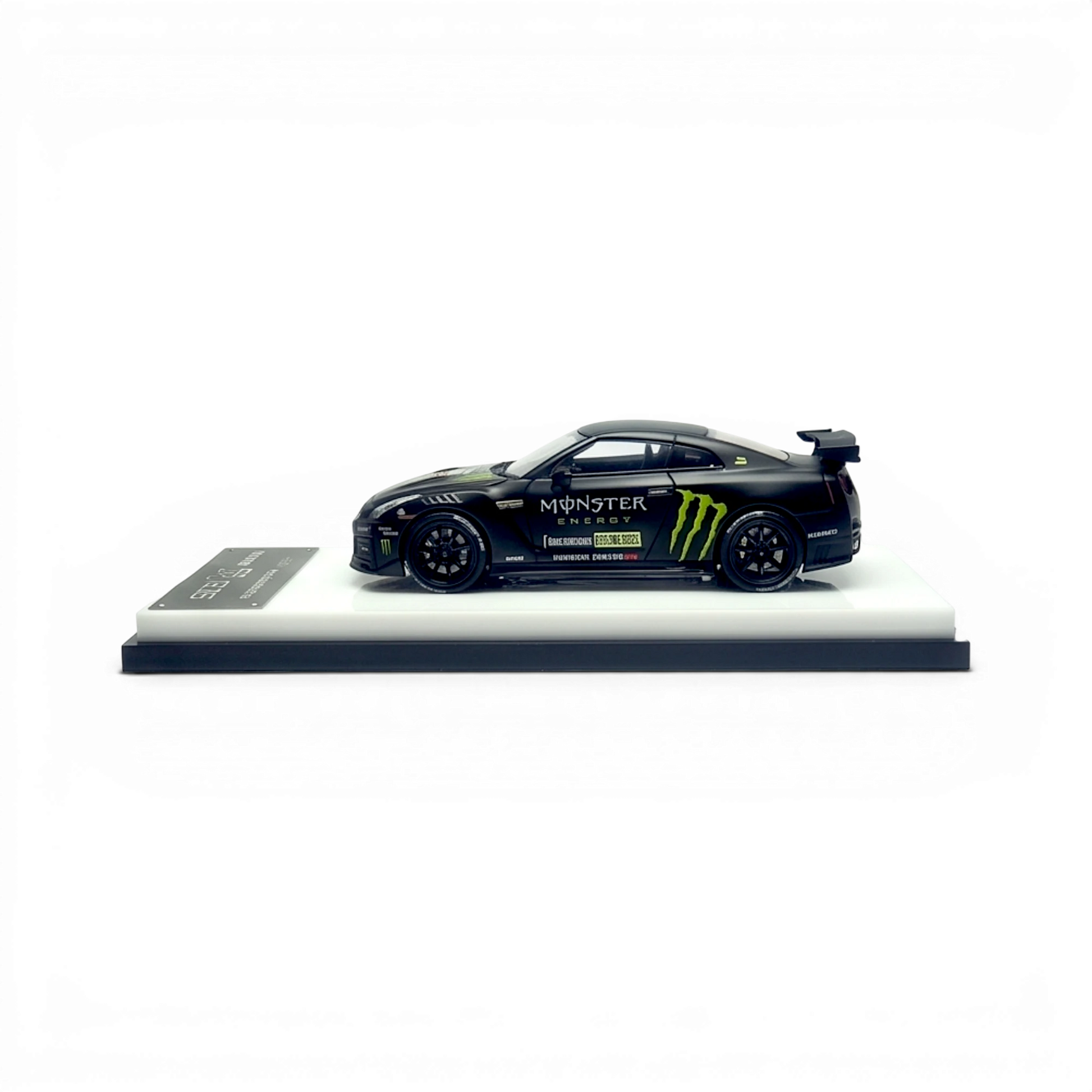 Lot57Supplies Diecast Shop 1:64 scale matte black MC GTR R35 NISMO model with Monster Energy livery and removable hood.