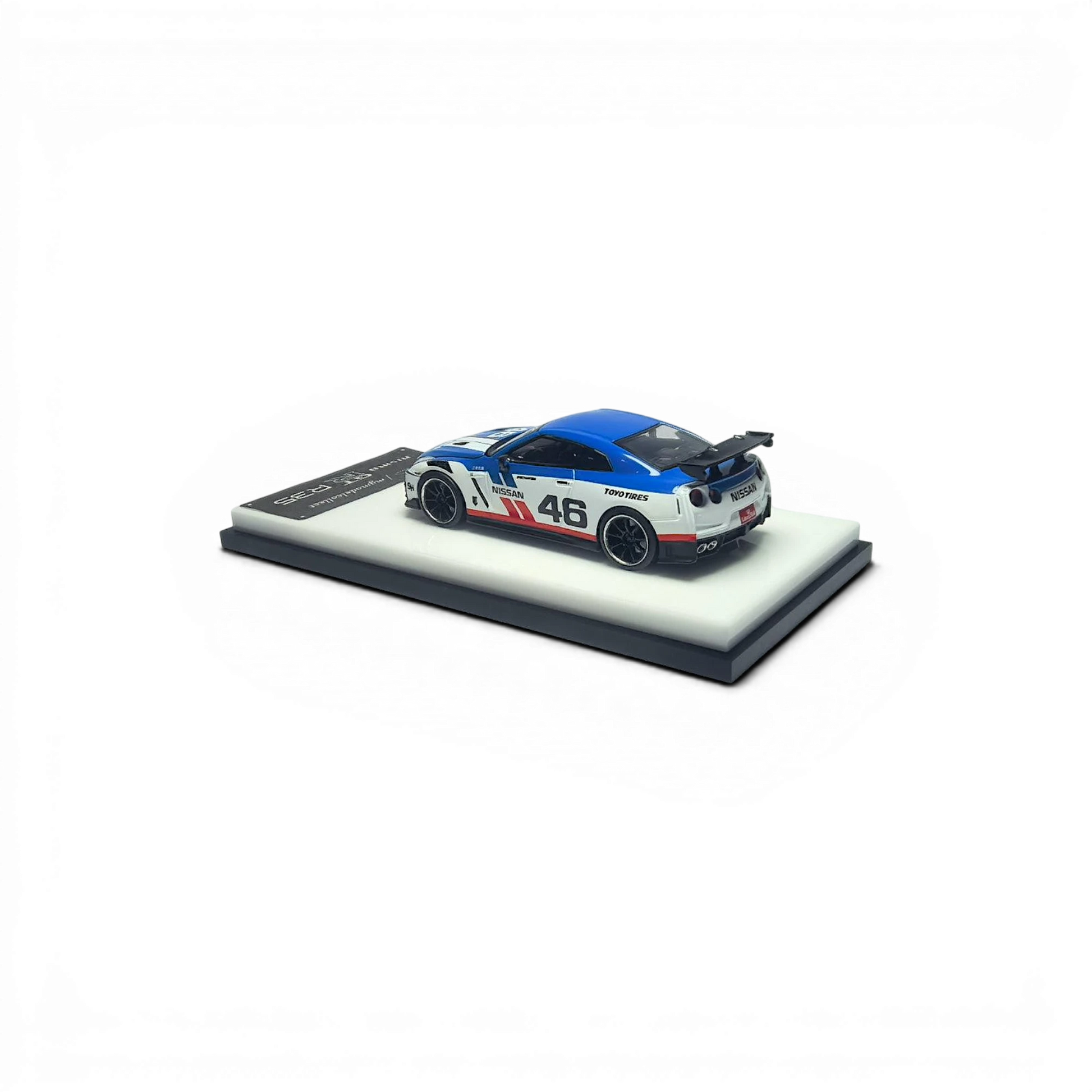 Lot57Supplies Diecast Shop 1:64 scale white and blue MC GTR R35 NISMO model car with #46 livery and removable hood.