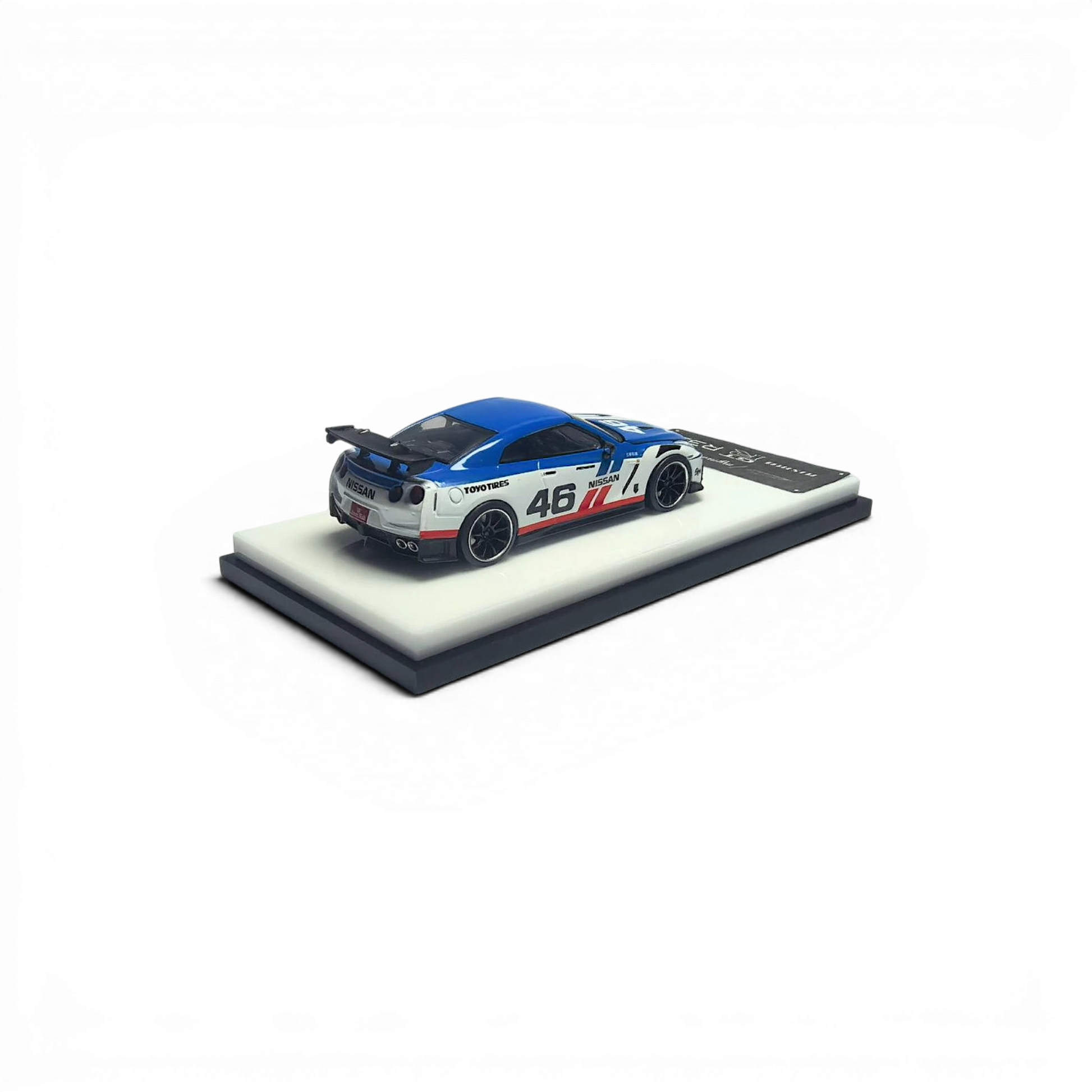 Lot57Supplies Diecast Shop 1:64 scale white and blue MC GTR R35 NISMO model car #46 with removable hood.