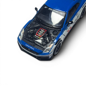 Lot57Supplies Diecast Shop 1:64 scale white and blue MC GTR R35 NISMO diecast model with open hood revealing engine detail.