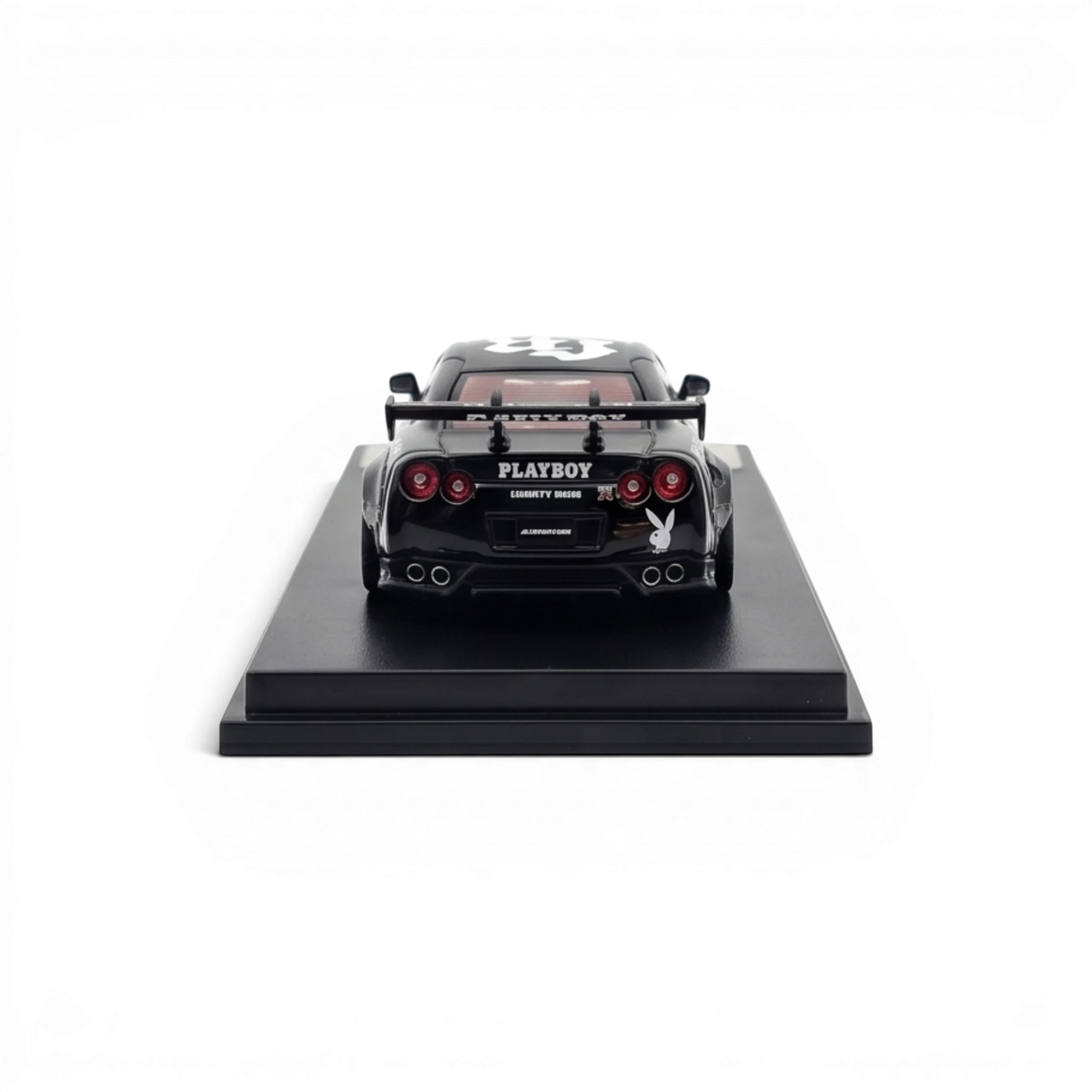 Lot57Supplies Diecast Shop 1:64 scale MC LB GTR 1.5 diecast car in glossy black with PLAYBOY livery, rear view.