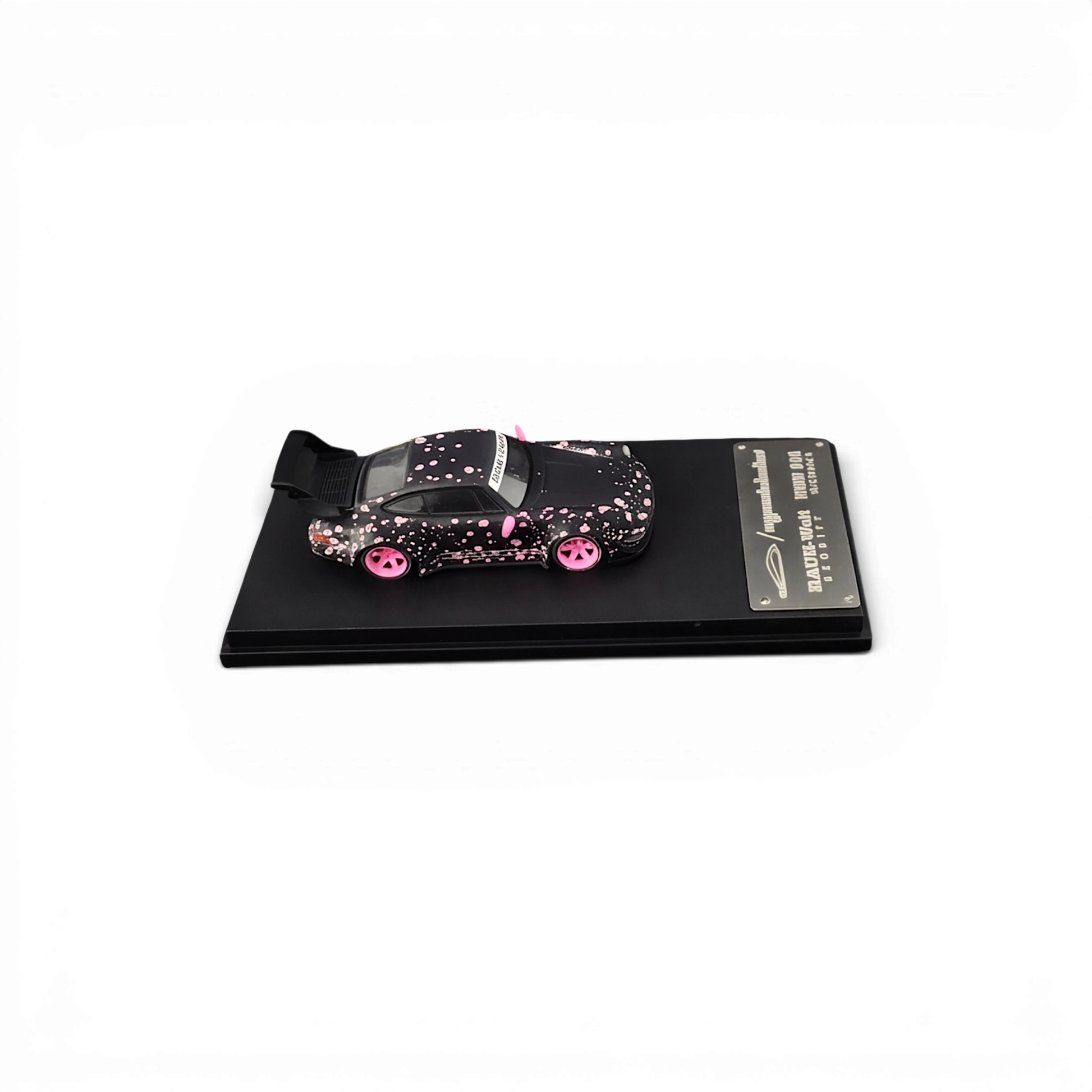 Lot57Supplies Diecast Shop MC RWB964 1:64 scale diecast car in black with pink sakura livery and high wing spoiler.