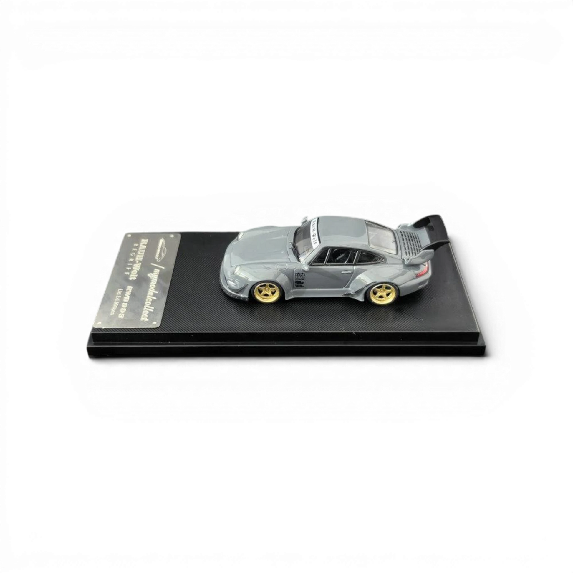 Lot57Supplies Diecast Shop MC RWB 993 G2 Single Deck Wing model car in cement grey with gold wheels, 1:64 scale.