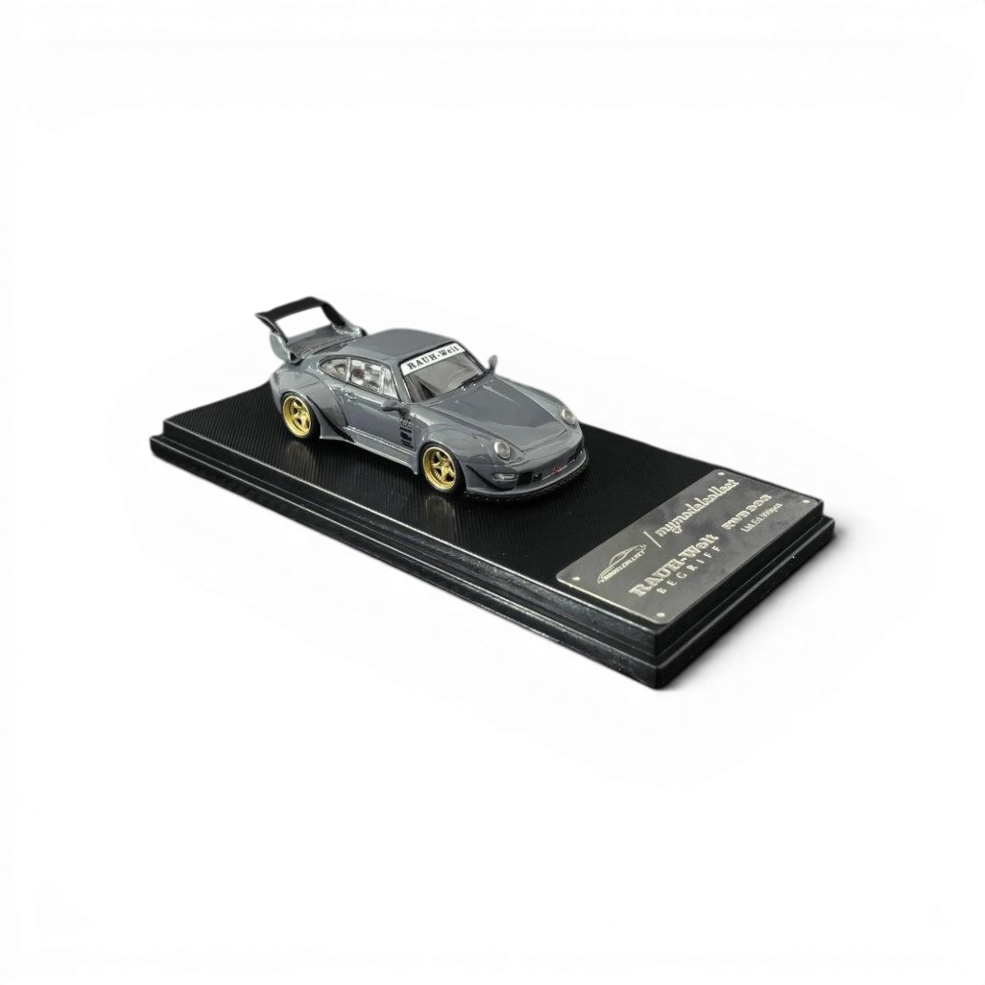 Lot57Supplies Diecast Shop MC RWB 993 G2 Single Deck Wing diecast model car in cement grey with gold wheels, 1:64 scale.