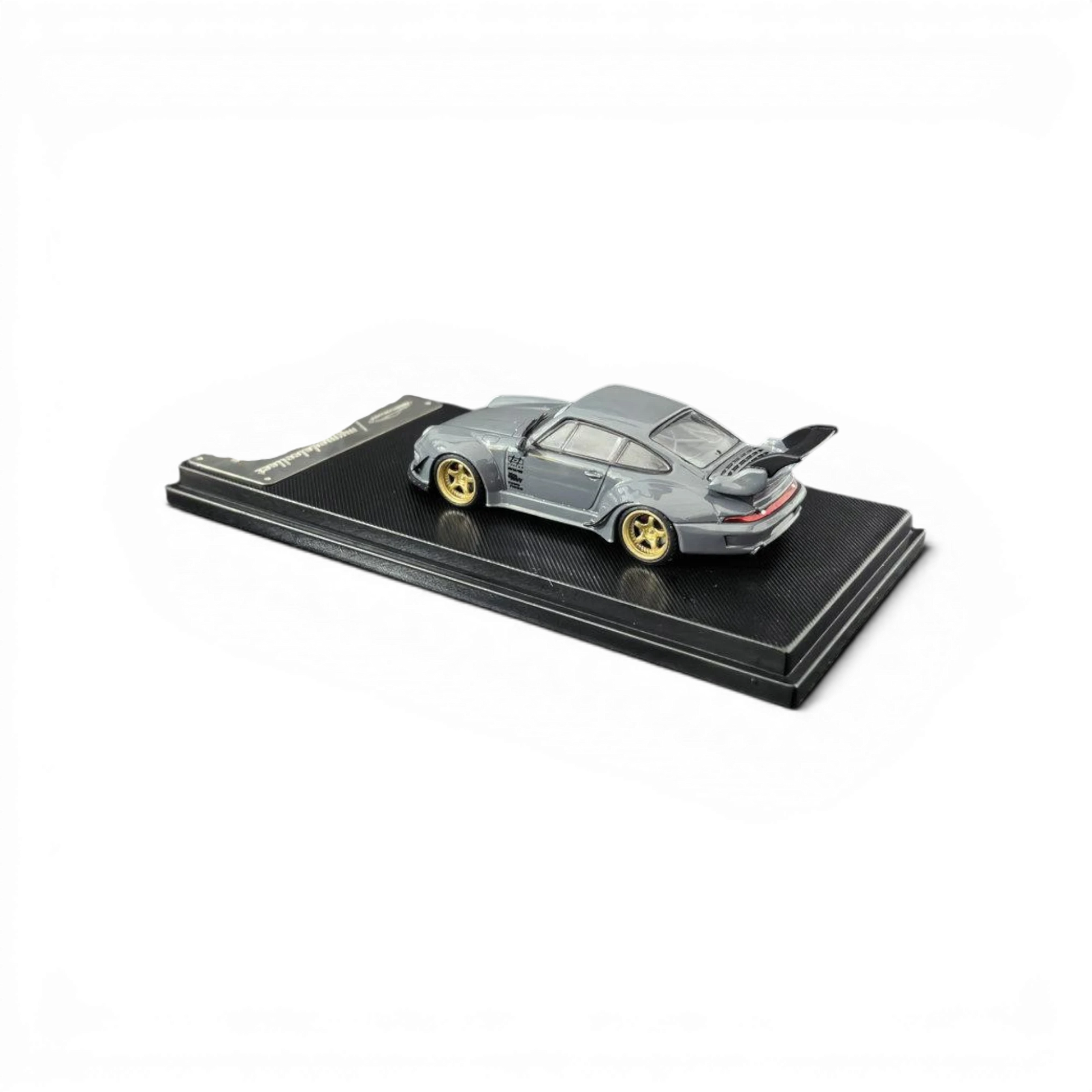 Lot57Supplies Diecast Shop MC RWB 993 G2 Single Deck Wing diecast model car, 1:64 scale, cement grey with gold wheels.