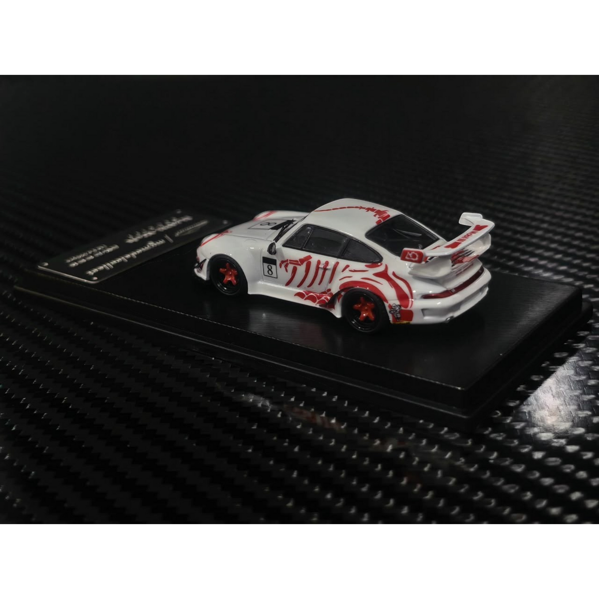 Lot57Supplies Diecast Shop 1:64 scale MC RWB993 diecast car in white with red bone dragon livery and high wing spoiler