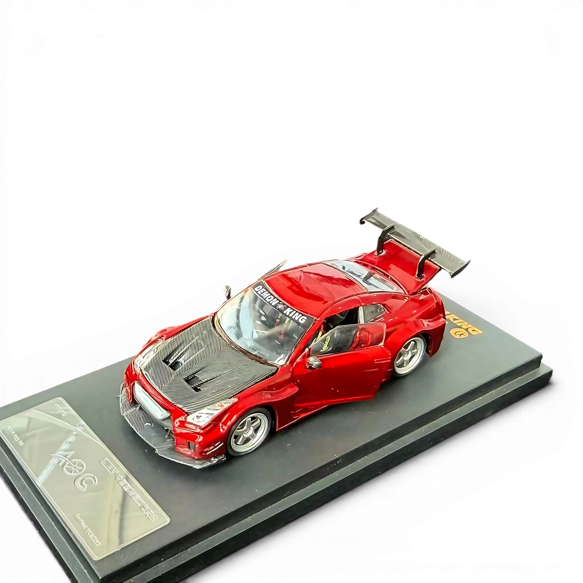 Lot57Supplies Diecast Shop AOC GT-R 35 RR 1:64 scale metallic red diecast model car with open doors on display base