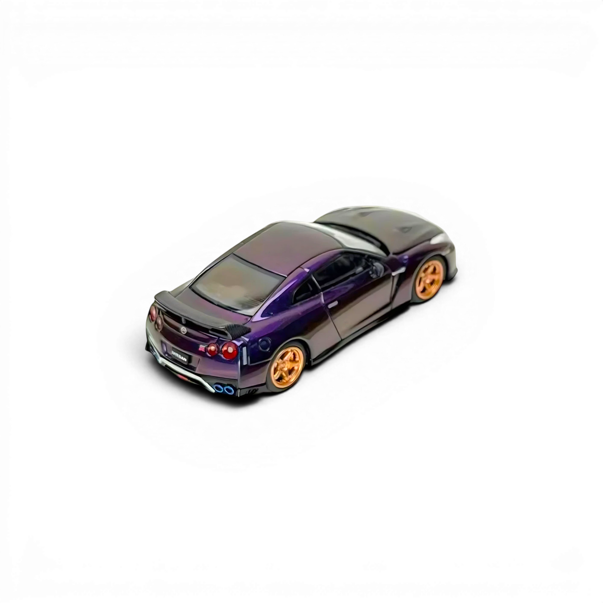 Lot57Supplies Diecast Shop MOTORHELIX 1:64 scale 2021 Nissan GT-R R35 diecast model in midnight purple with gold rims