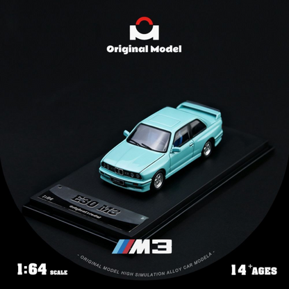 Lot57Supplies Diecast Shop 1:64 scale mint green BMW E30 M3 diecast model car on a black display base