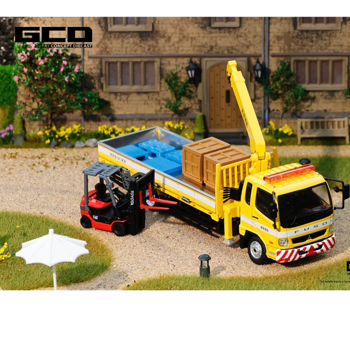 Lot57Supplies Diecast Shop 1:64 scale yellow Mitsubishi Fuso crane truck with red forklift and cargo in a diorama