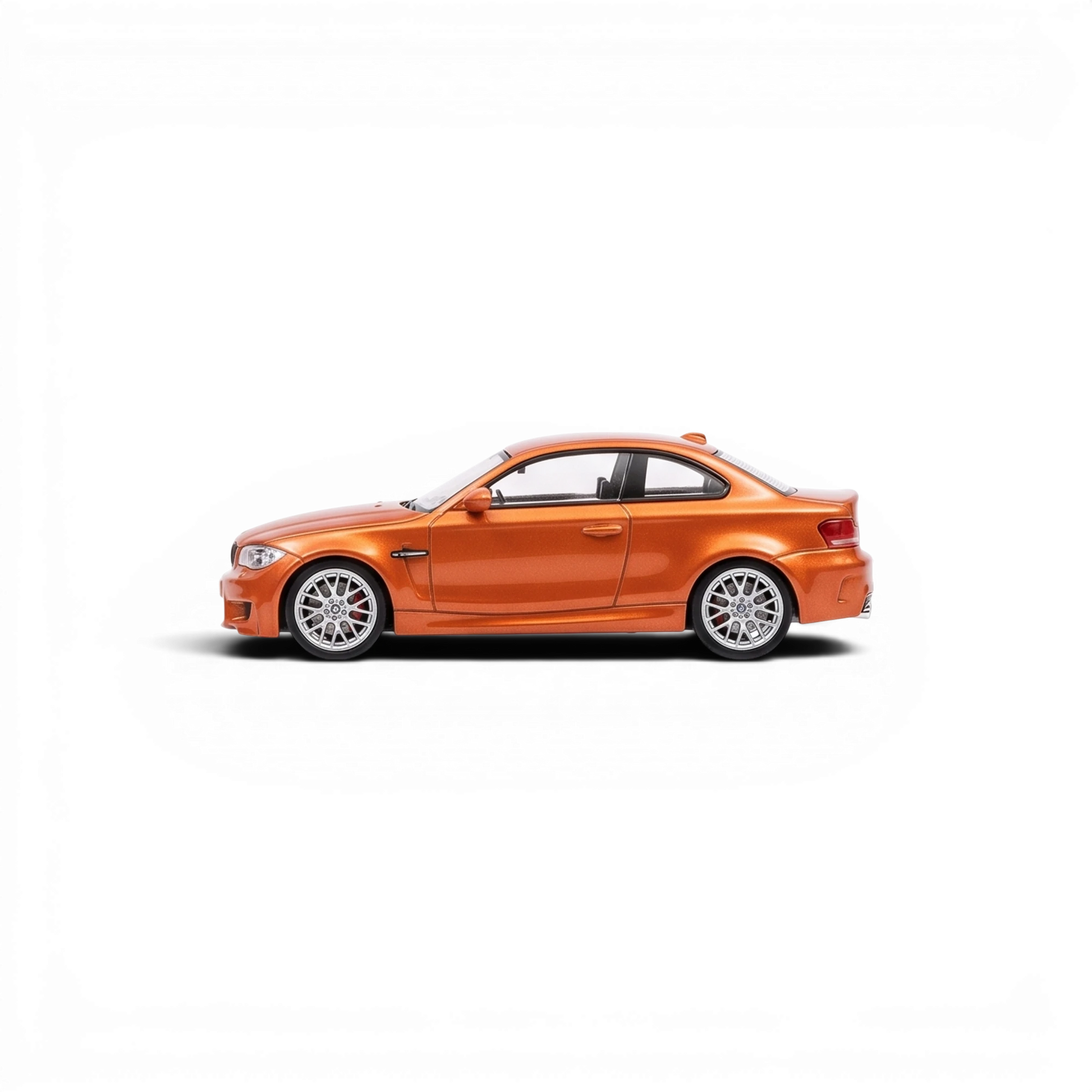 Lot57Supplies Diecast Shop MORTAL 1:64 scale Valencia Orange BMW 1M Coupe diecast model car, side profile view.