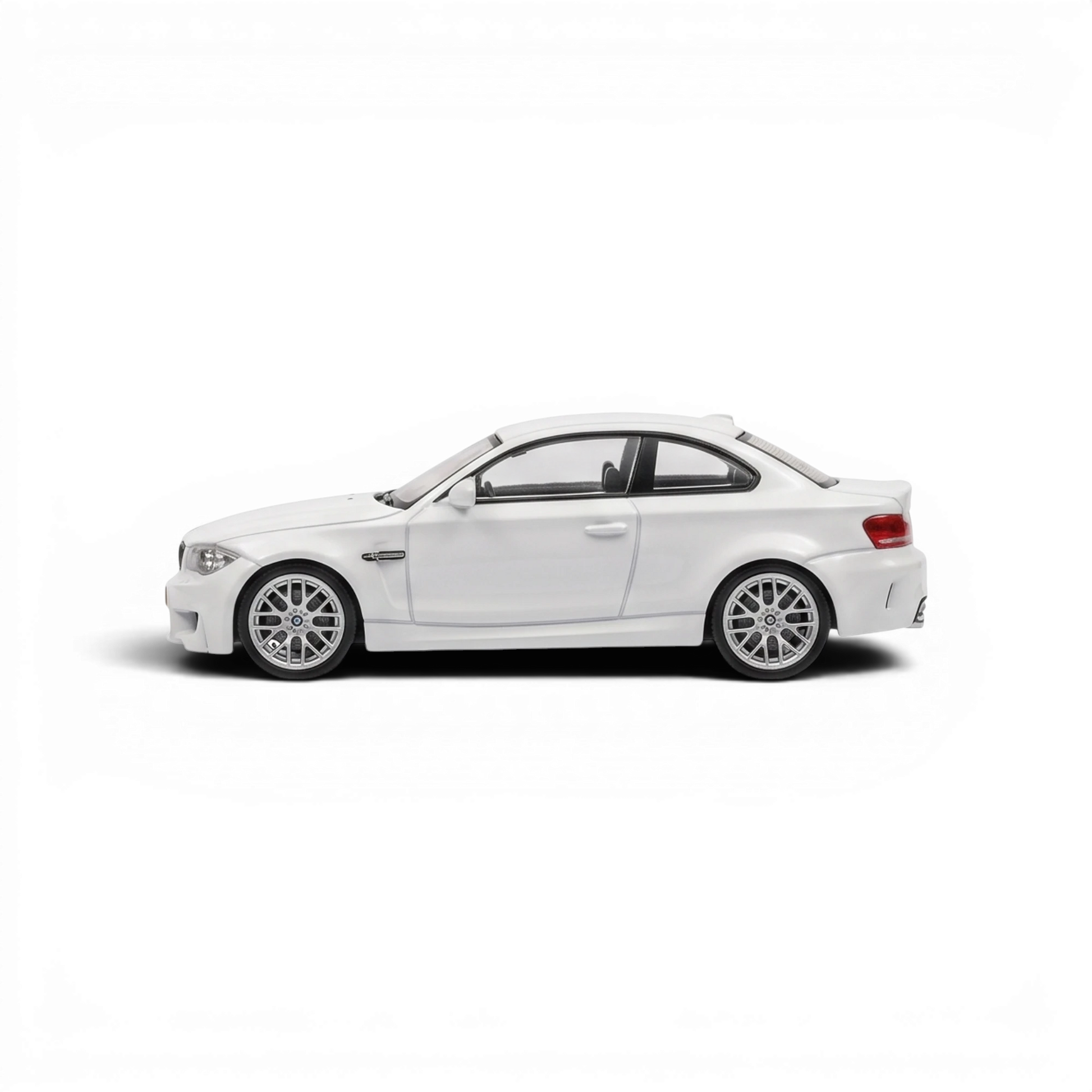 Lot57Supplies Diecast Shop MORTAL 1:64 scale pearl white BMW 1M Coupe diecast model car, side profile view.