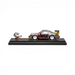 MotorHelix RWB 964 Aoki Sakura 1:64 scale diecast model car with cherry blossom livery and yellow spoiler.