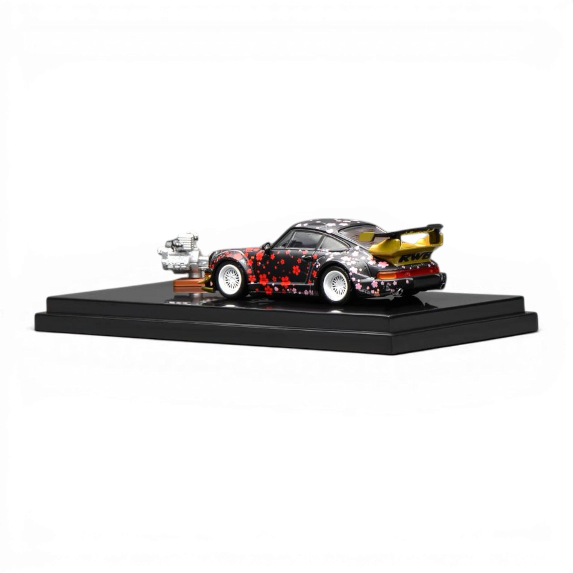 Lot57Supplies Diecast Shop MotorHelix RWB 964 Aoki Sakura 1:64 scale diecast model car with cherry blossom pattern and gold spoiler.