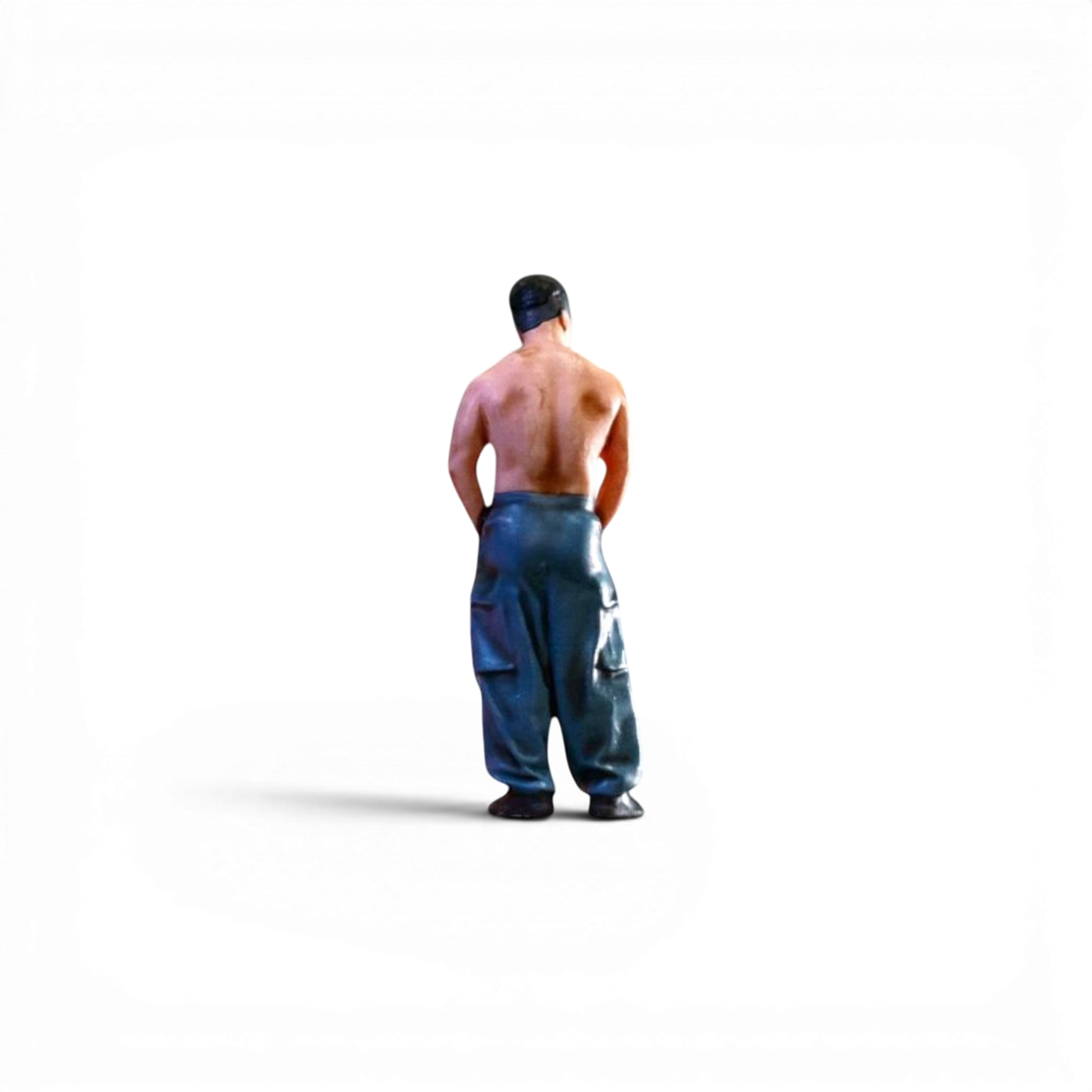 Lot57Supplies Diecast Shop EHC Model 1:64 scale resin muscle man figure wearing dark cargo pants, back view.