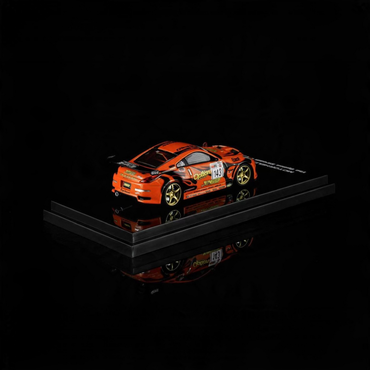 Lot57Supplies Diecast Shop 1:64 scale orange Nissan Fairlady Z Z33 Option Stream Z diecast model car on display base