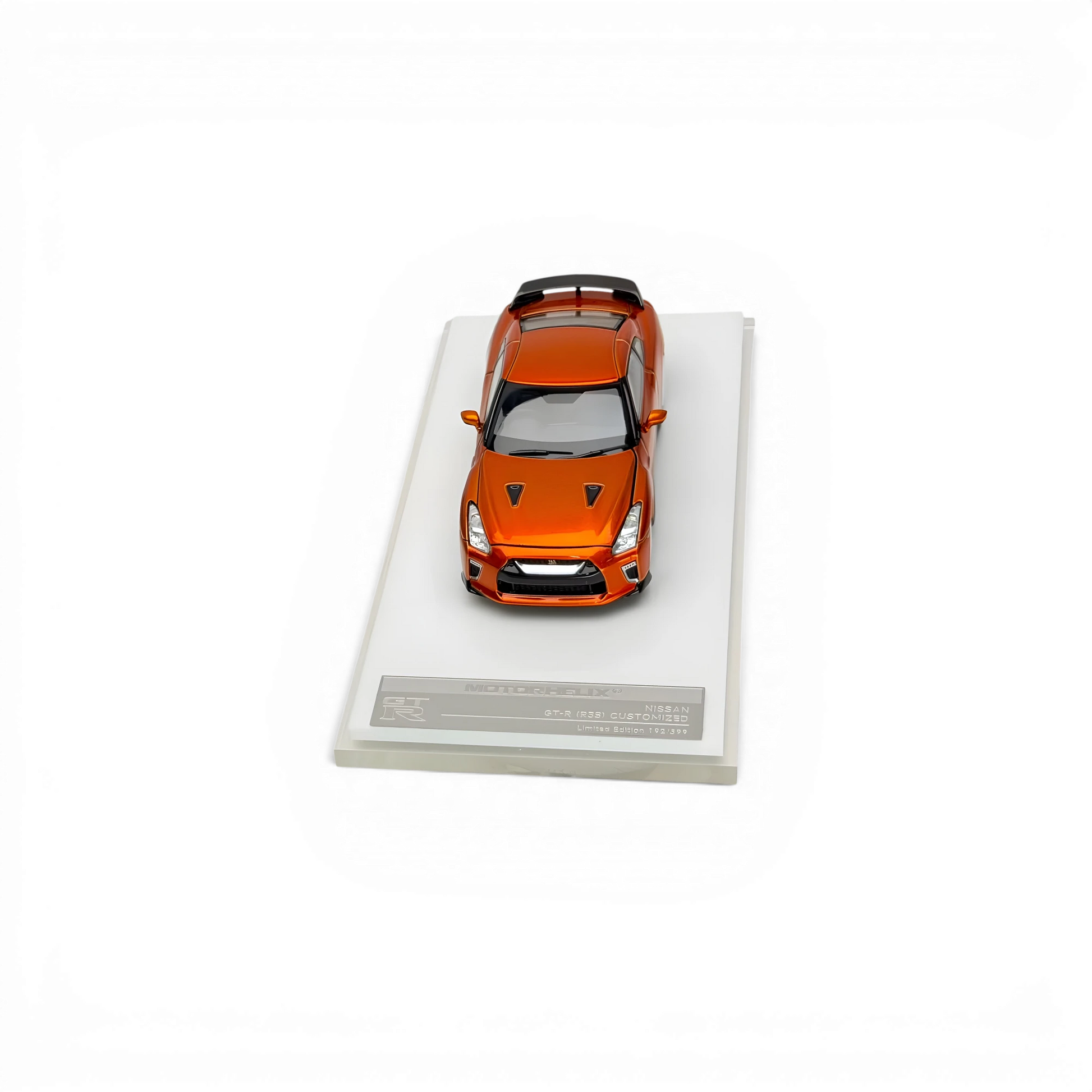 Lot57Supplies Diecast Shop 1:64 scale Motorhelix Nissan GT-R R35 2021 diecast model car in metallic sunset orange.